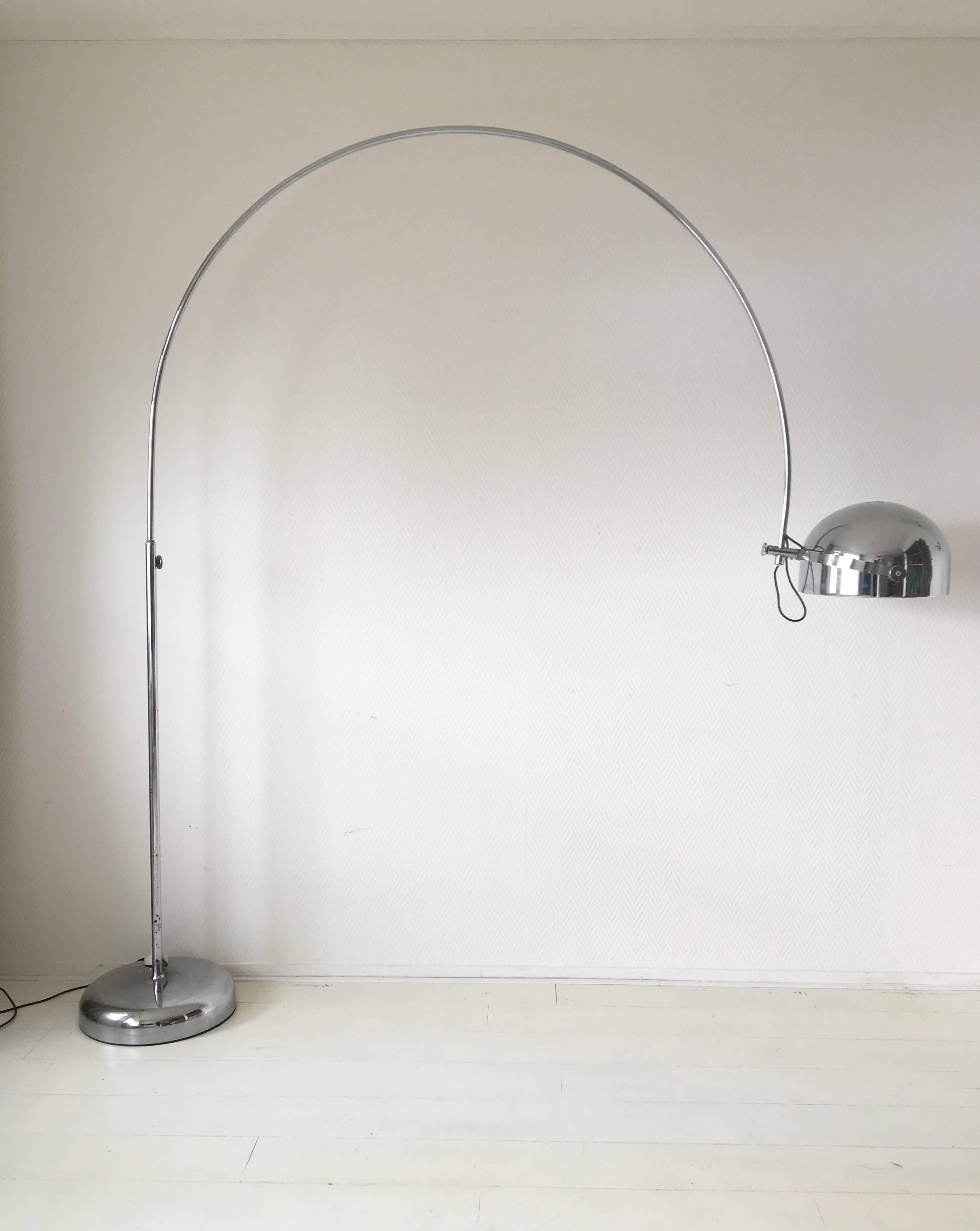 This large midcentury lamp was manufactured by Gepo Amsterdam in the Netherlands, circa 1960s. Most likely it was designed by the Gebroeders Posthuma. The lamp features a heavy chromed metal base which can be rotated 360 degrees. The shade can also