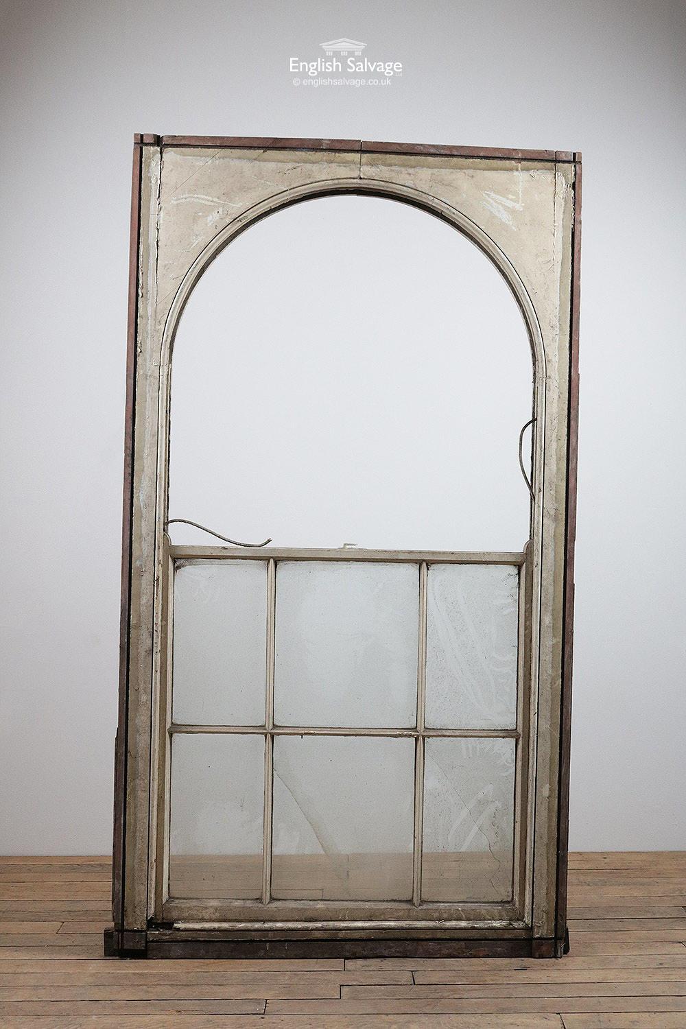 Reclaimed large arched sash window in pine frame with an oak sill. Missing its top half. Clear glass. Needs attention as shown in photos. One of a selection salvaged from the same property. Measurements below (+/- 5cm) are the external overall of