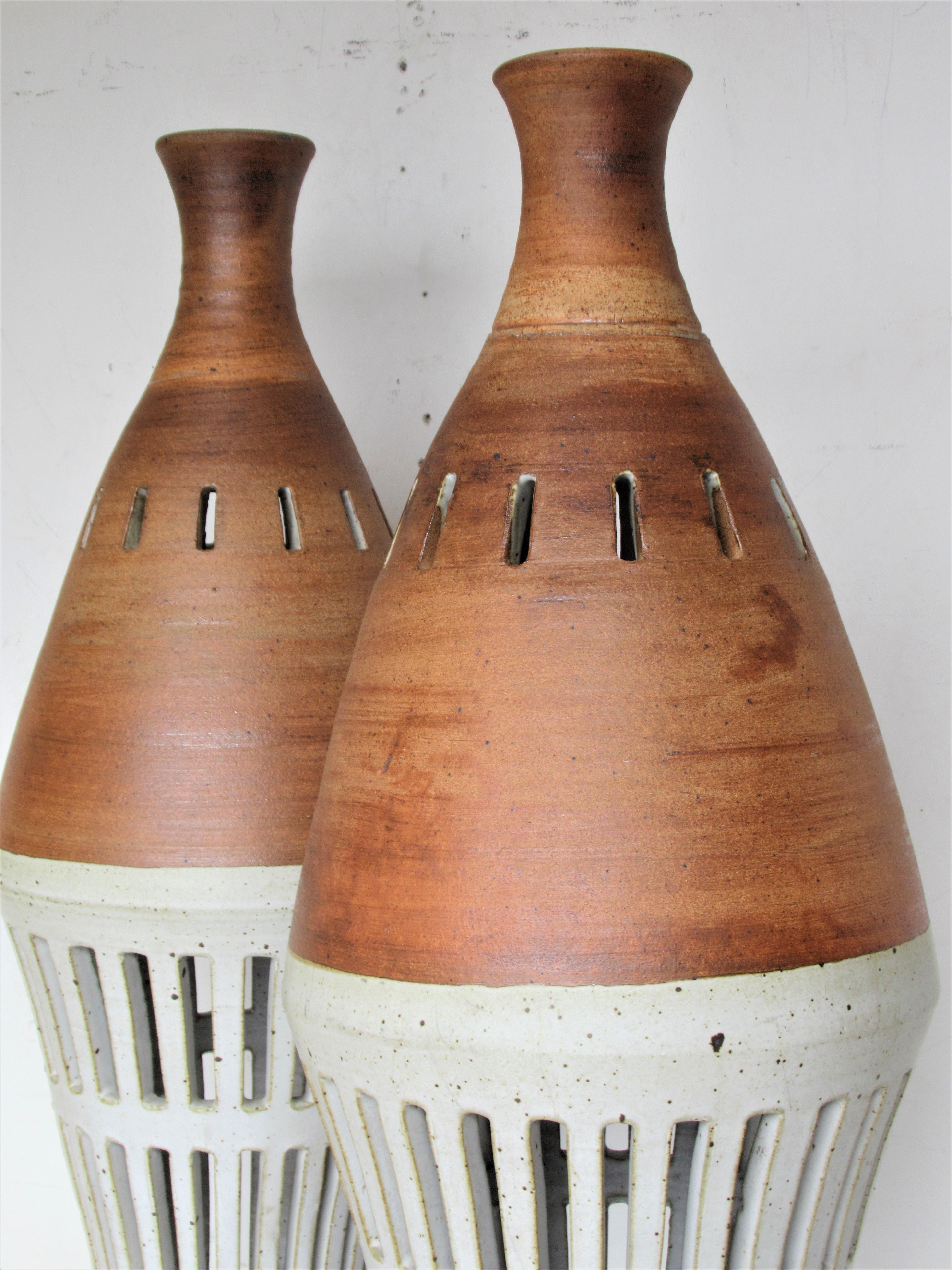 A rare pair of American studio ceramic large architectural modernist hand built glazed stoneware pendants by Philip Secrest, Alfred University of Ceramics - studied under Daniel Rhodes. These were an original commission for a mid-20th century modern