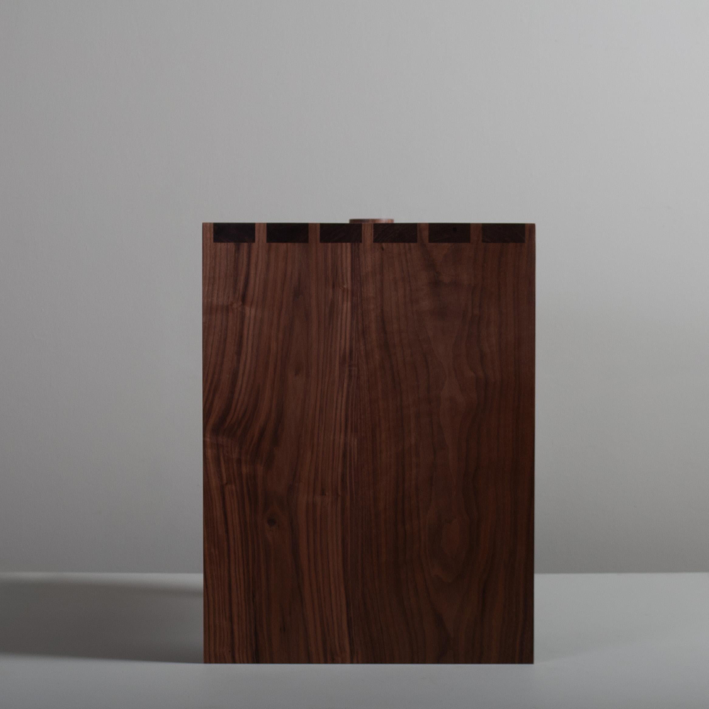 Large handcrafted architectural American black walnut end or side table. Designed by Sum furniture and handcrafted in England using traditional furniture making techniques with the finest American Black Walnut. Hand-cut oversized dovetail jointing