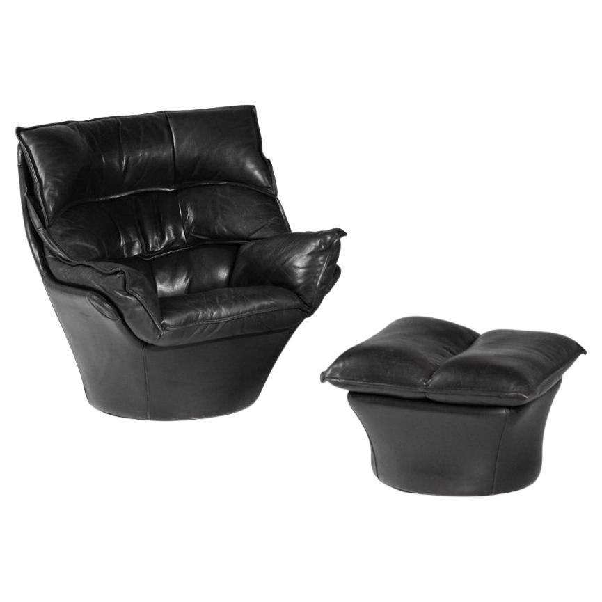 Large armchair and footrest in black leather Bernard Massot years 70/80 For Sale