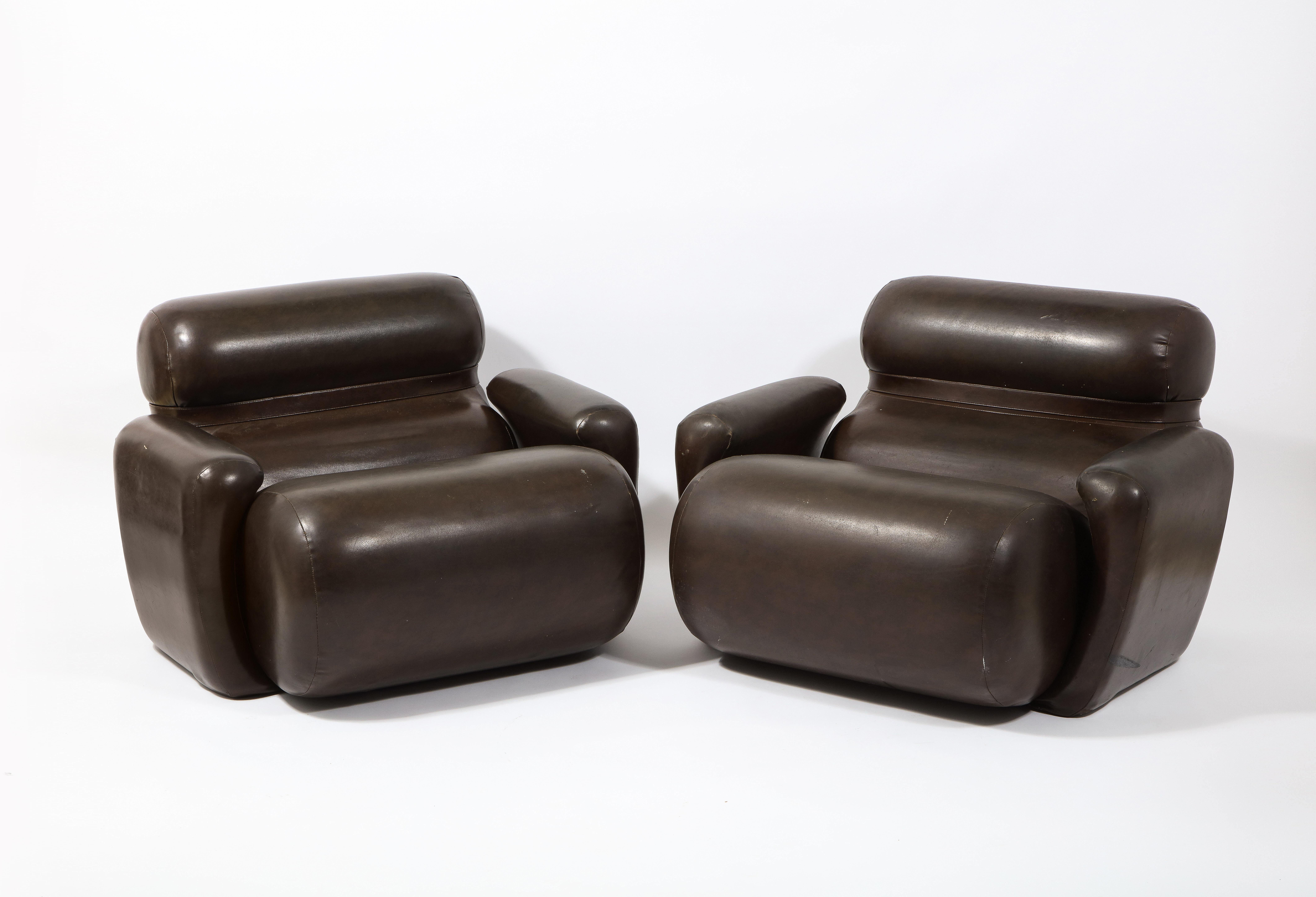Large pair of injected foam armchairs with their original vinyl upholstery. Very comfortable.