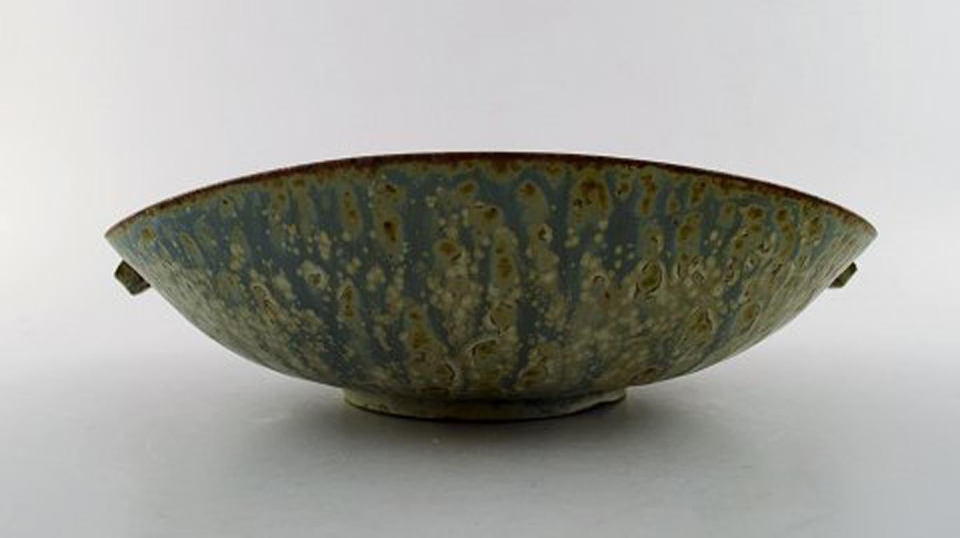 Large Arne Bang ceramic bowl.
Danish design mid-20th century.
Glaze in blue and green shades.
Marked AB.
In perfect condition.
Measures: 22 x 7 cm.