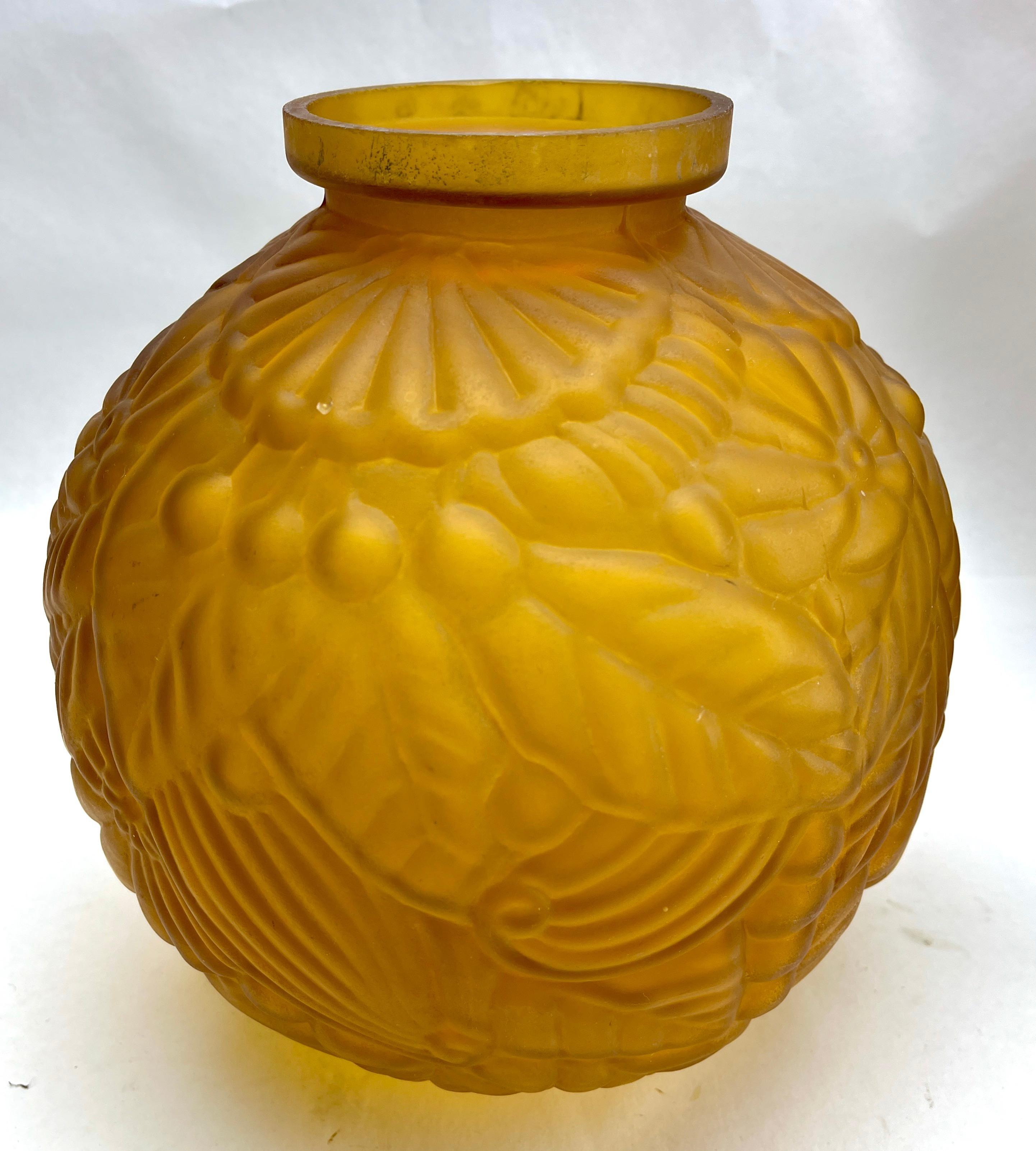 Large Art Deco ball vase in gold-coloured opaline  frosted glass. 
Technique press-moulded France 1930
Attractive decoration of stylized leaves and flowers in relief.

Please don't hesitate to get in touch with any further questions.  
With Best