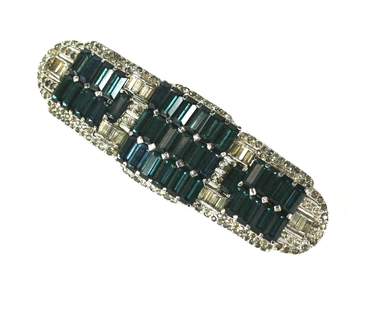 Large Art Deco Bar Brooch with teal blue baguettes set side by side in a pave Art Deco surround. Large striking size and lovely quality period brooch. 1930's USA. 
3.5