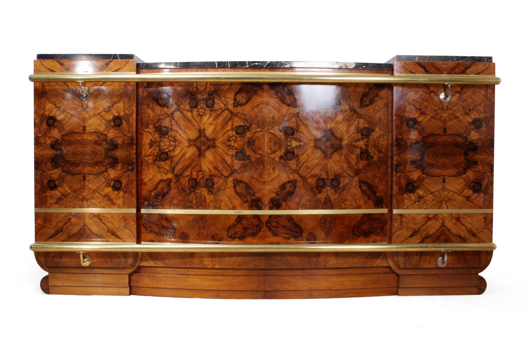 Large Art Deco bar in walnut
This French bar has come out of a cocktail bar in the south of France, this made from two 1930s sideboards by cabinetmakers, it is very large with a figured walnut front solid mahogany base, brass rails top and bottom,