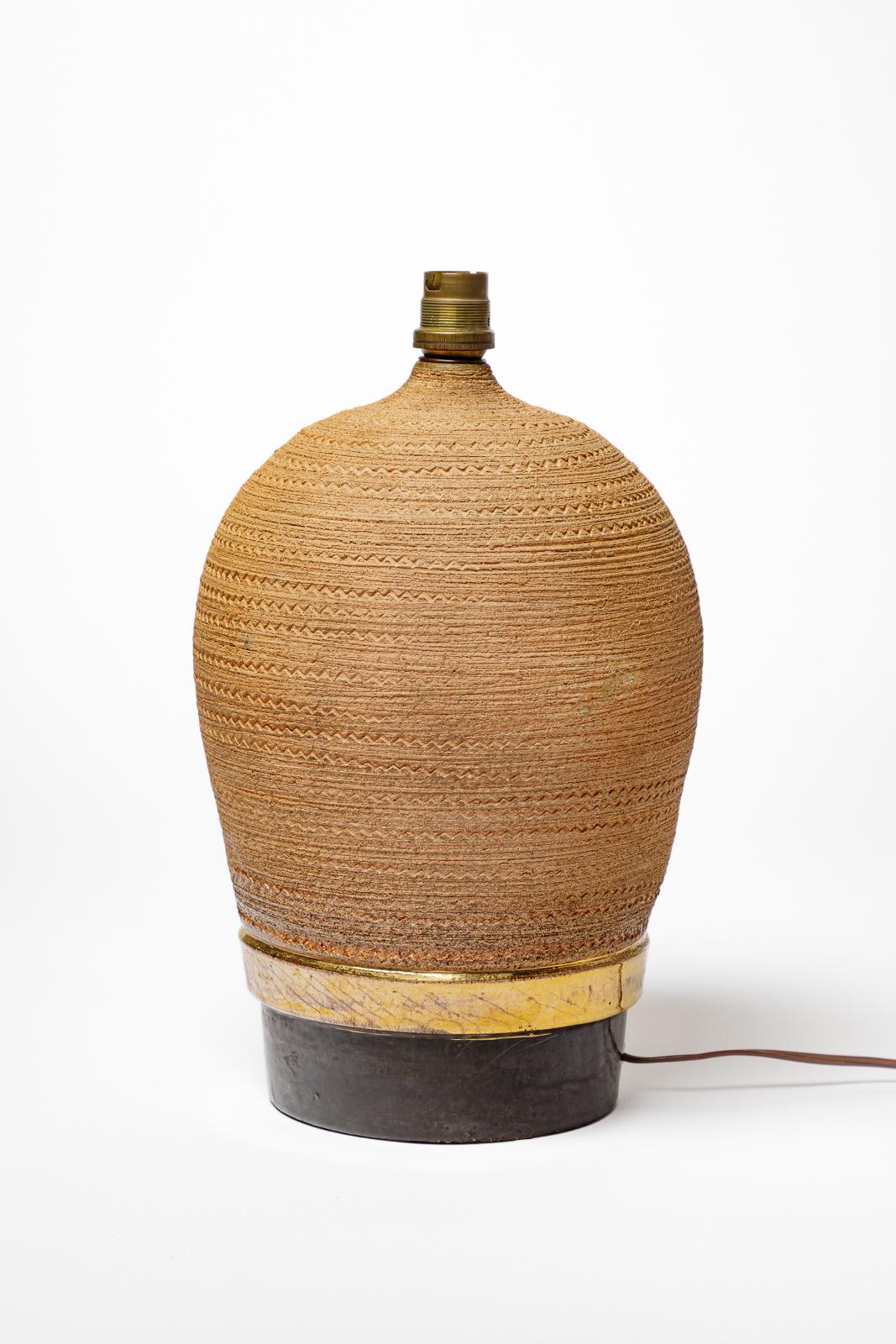 Made in France

Unique handmade art deco ceramic table lamp.

Realised circa 1930

Brown, black and gold ceramic glazes colors

Electrical system is ok 
Sold without lampshade

Ceramic height 29 cm
Large 17 cm
Total height with electrical system 33