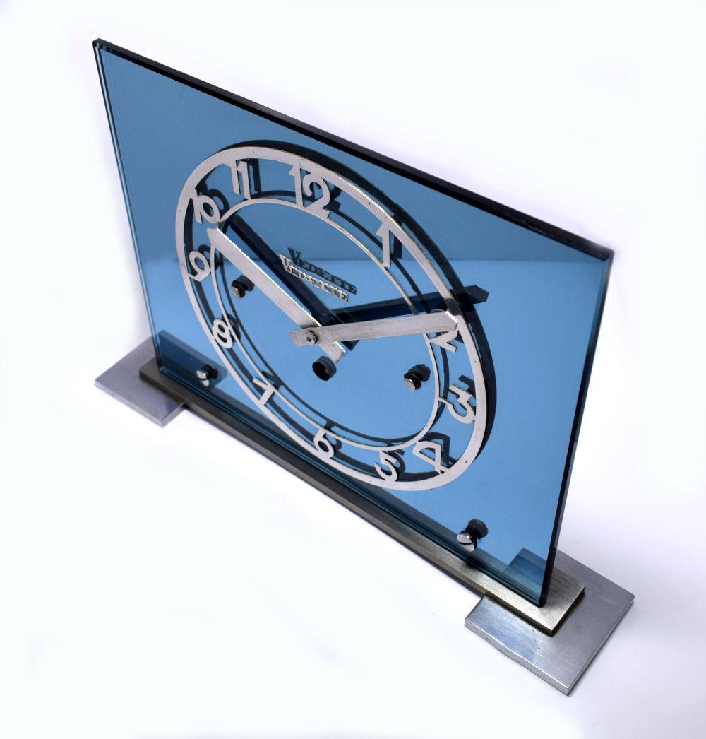 Large and impressive 1930s Art Deco blue mirror clock by Vedette. The clock originates from France, quite a weighty piece. Chromed bezel and clock hands with the makers name centre dial. We believe the base is chromed steel, which is in good order