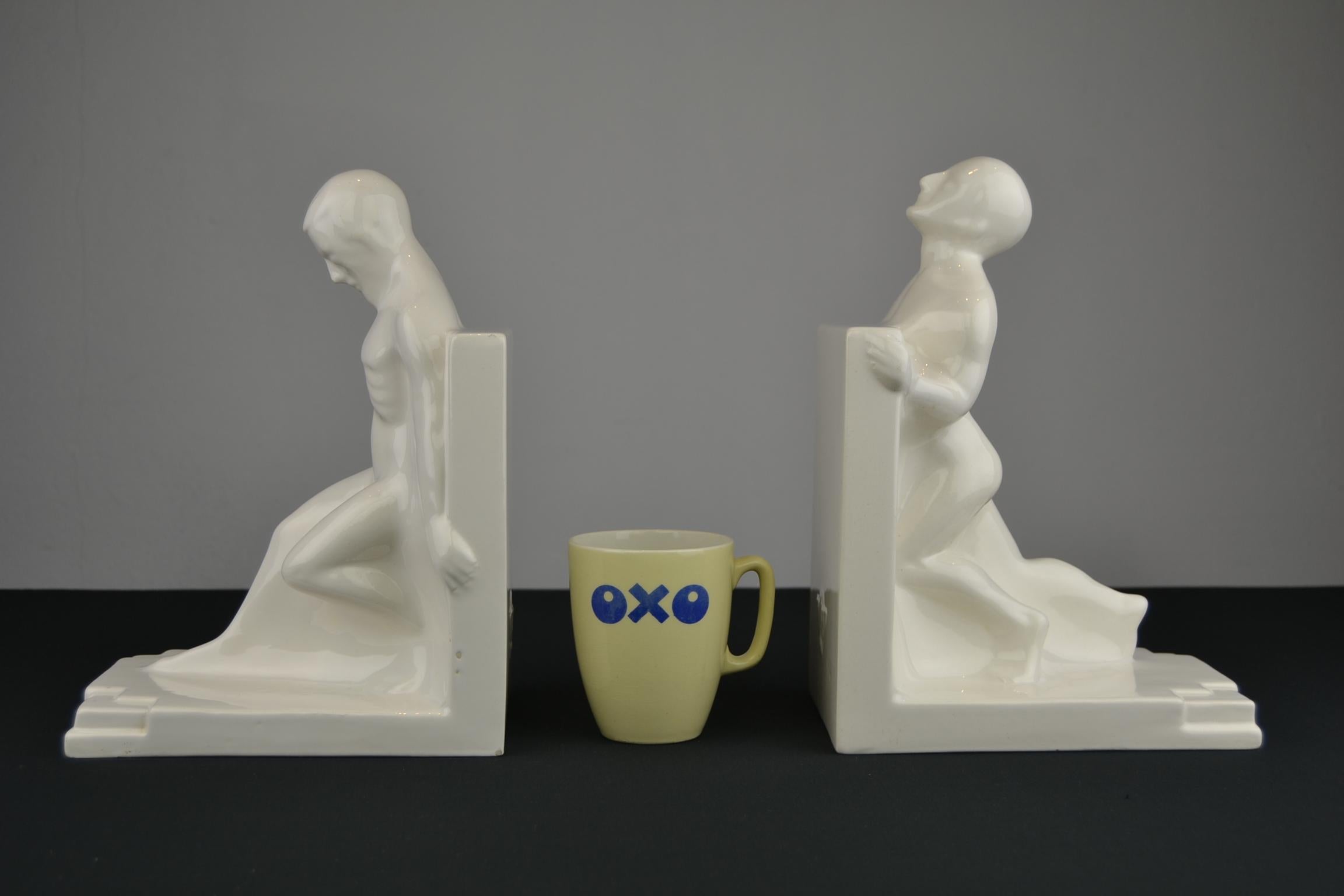 Large Art Deco bookends of nude muscular man in white glazed ceramic.
These spectacular set of Large Bookends were Designed by Godefridus Boonekamp in the 1920s and made in the Netherlands by Plateelbakkerij Schoonhoven, circa 1930s. 

As these