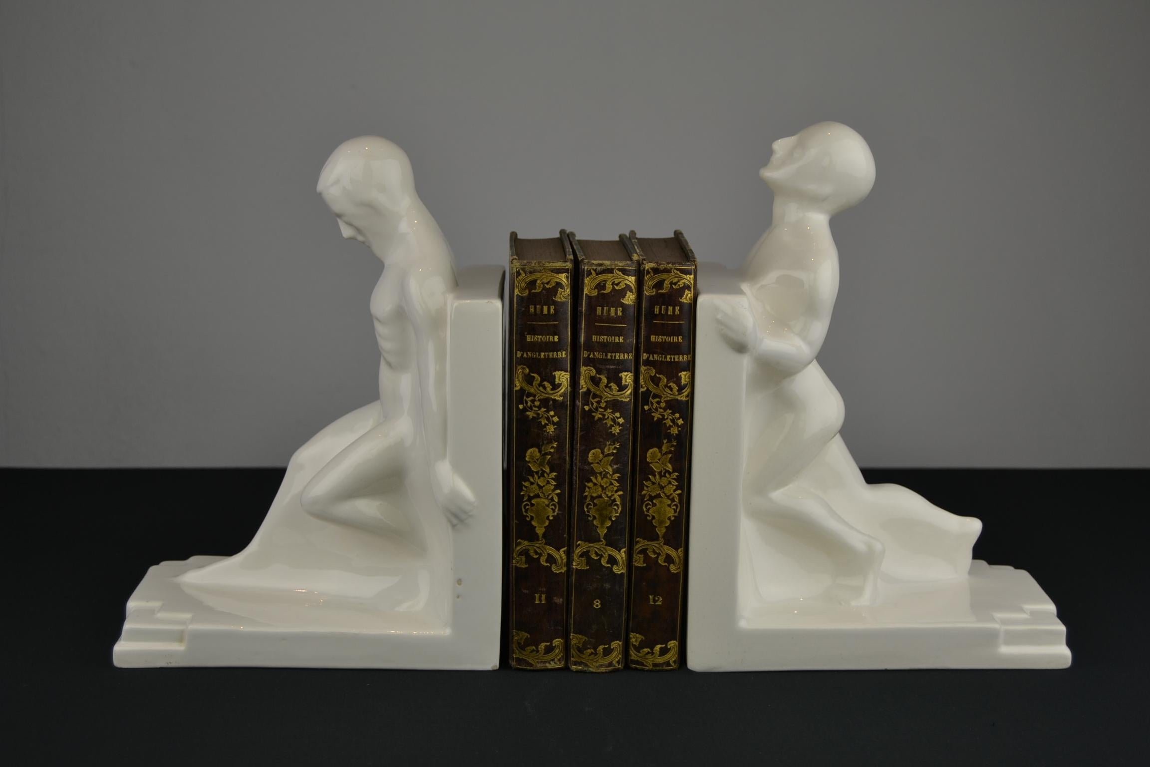 20th Century Large Art Deco Bookends with Nude Muscular Males in White Glazed Ceramic