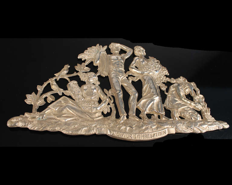 Large Art Deco wall art / sculpture, circa 1930. Cast bronze, silver plated, titled the 4 seasons The panel features scenery of life during the 4 seasons, springtime with the sitting lady listening to a singing bird, the man holding the summer wheat
