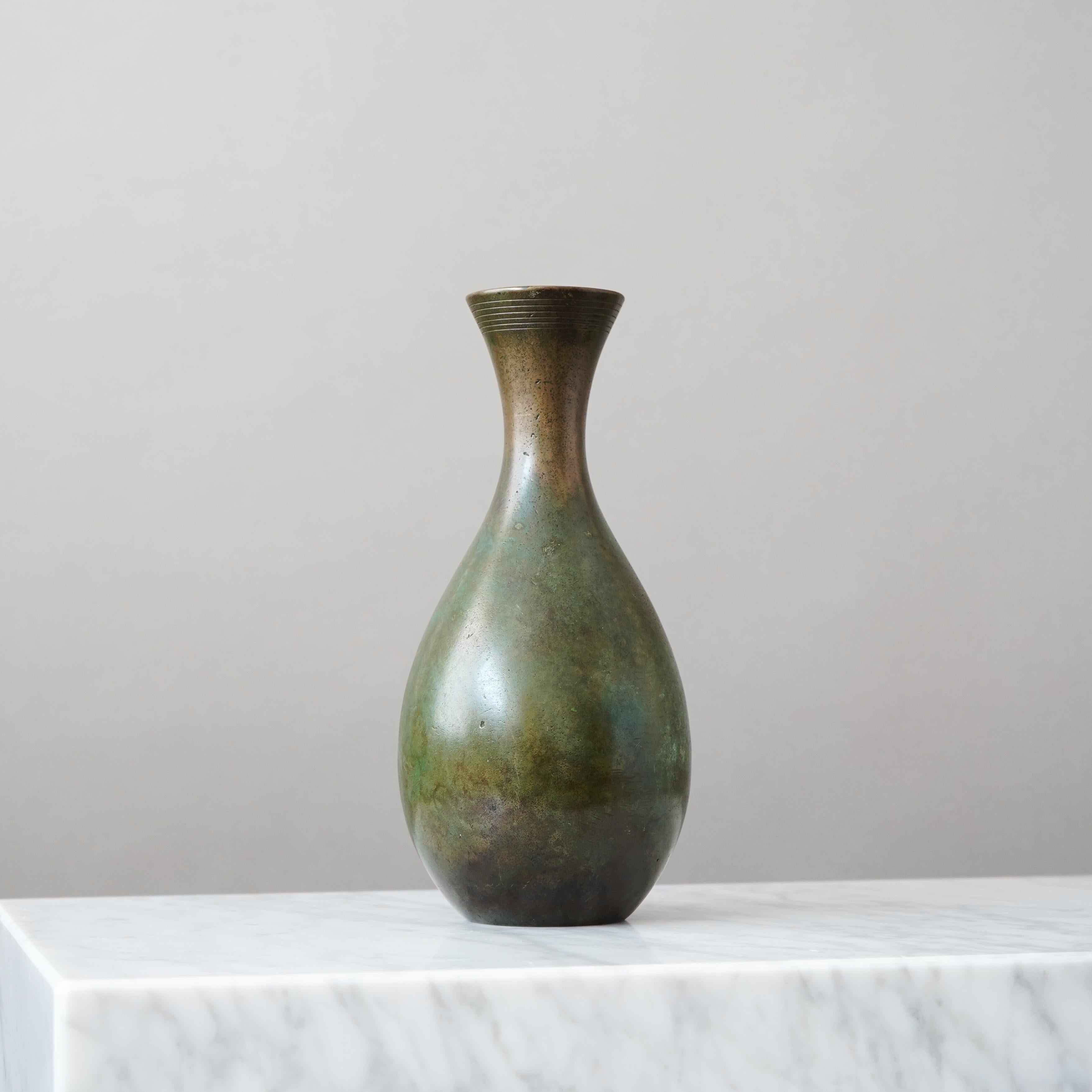 A large and beautiful bronze vase with amazing patina. 
Made by GAB Guldsmedsaktiebolaget, Sweden, 1930s.  

Fair condition, with scratches and wear to the patination.
Stamped 'BRONS' and makers mark.

GAB was founded in Stockholm in 1867 and was an