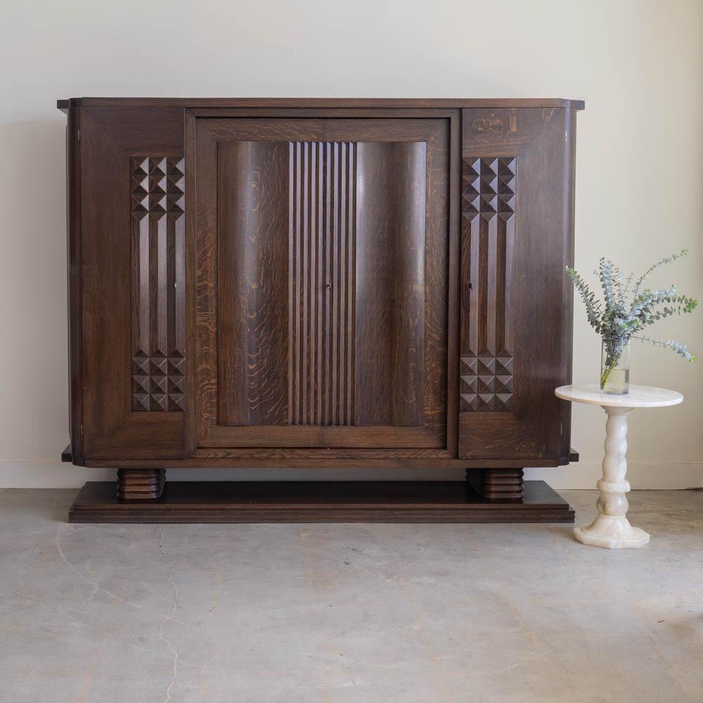 French Large Art Deco Carved Wood Cabinet by Charles Dudouyt For Sale
