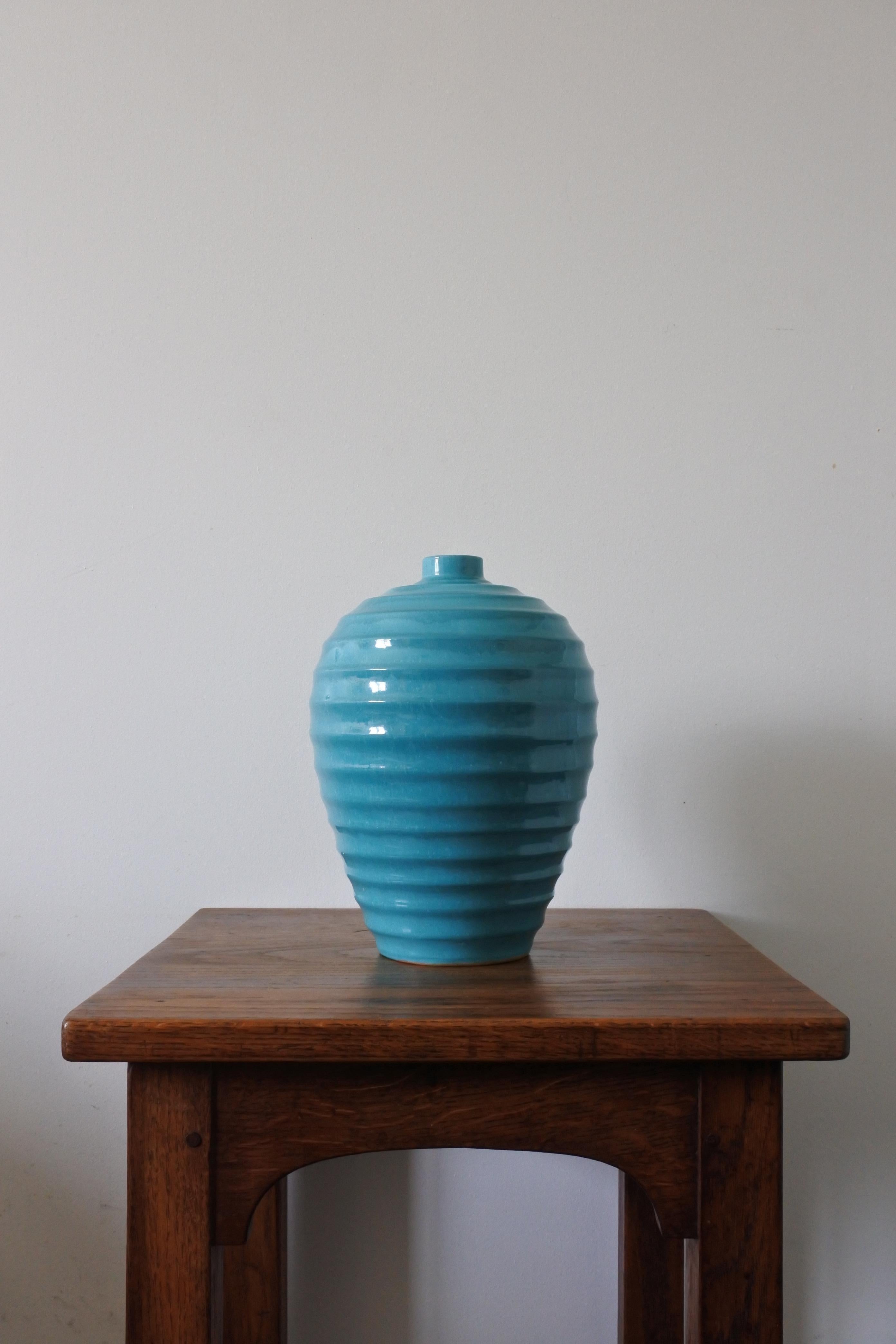Large Art Deco ceramic vase by Primavera.
Made in France in the 1930s.
Deep turquoise blue glaze.
Stamped Made in France.

Atelier Primavera was the art studio of Le Printemps, renowned parisien department store.
Colette Gueden was the