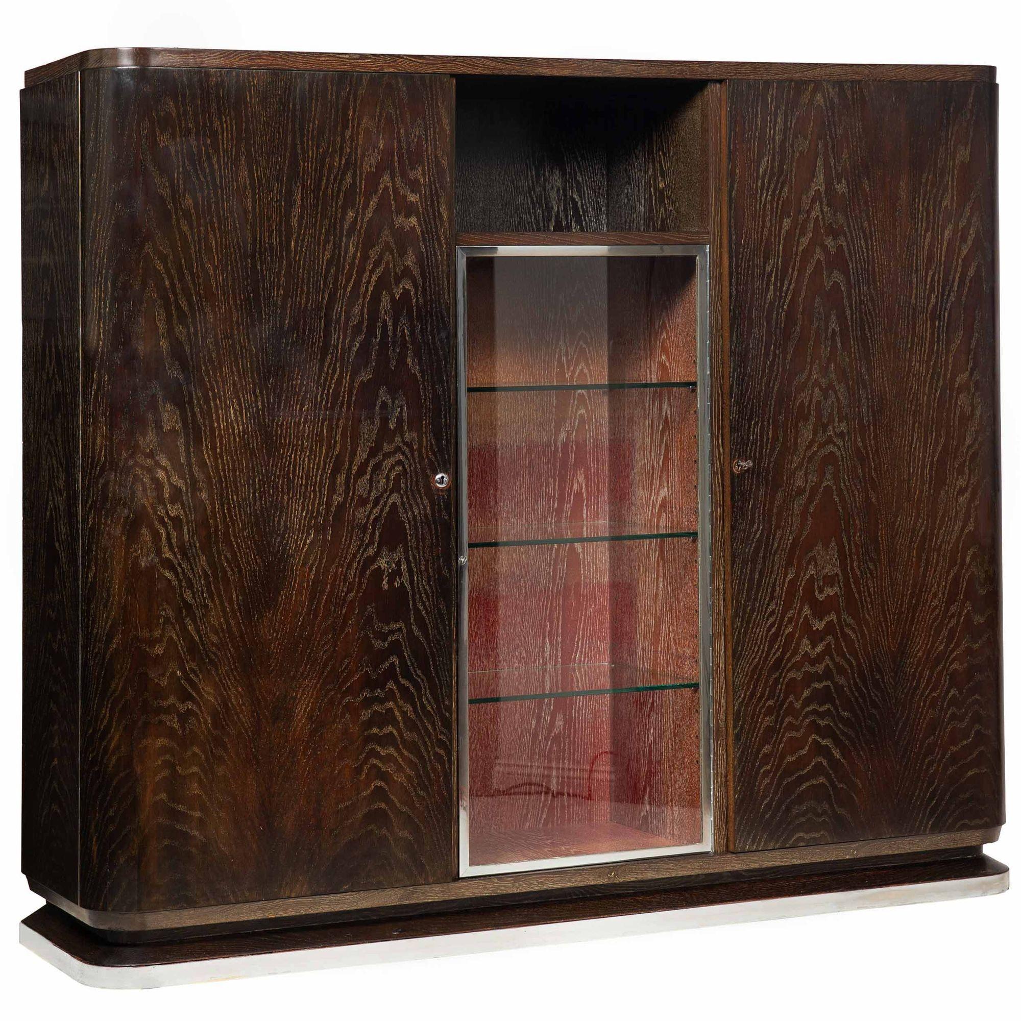 ART DECO CERUSED AND EBONIZED OAK DISPLAY CABINET WITH FLANKING BLIND BOOKSHELVES
Probably German, as the locks are of German origin  executed circa 1940  with chromed steel accents throughout
Item # 401QGP02S

A fabulous Art Deco era display