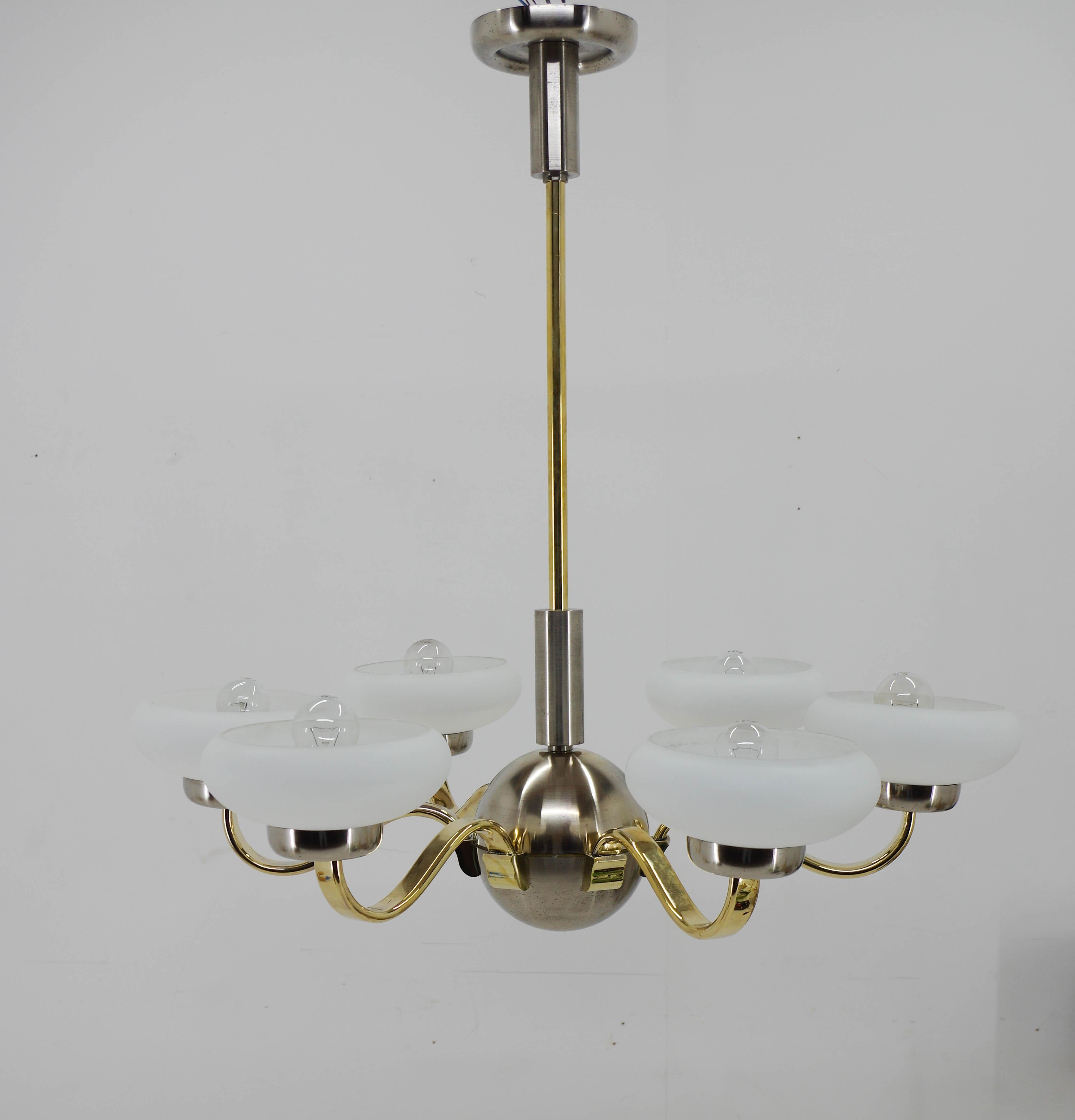 Large beautiful Art Deco chandelier made in 1930s.
Restored: nickel with minor age patina polished. Brass arms polished. Rewired: two separate circuits - 3+3x60W, E25-E27 bulbs
US wiring compatible