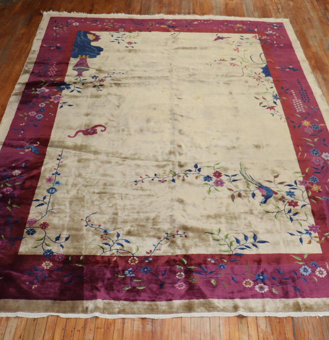 An authentic mid-20th century Chinese Art Deco with an enchanting floral motif in predominant wine, navy blue accents on a beige ground. The wool has a silky feel to it
Room size formats are usually found in the 8 x 10, 9 x 12 size range, this one