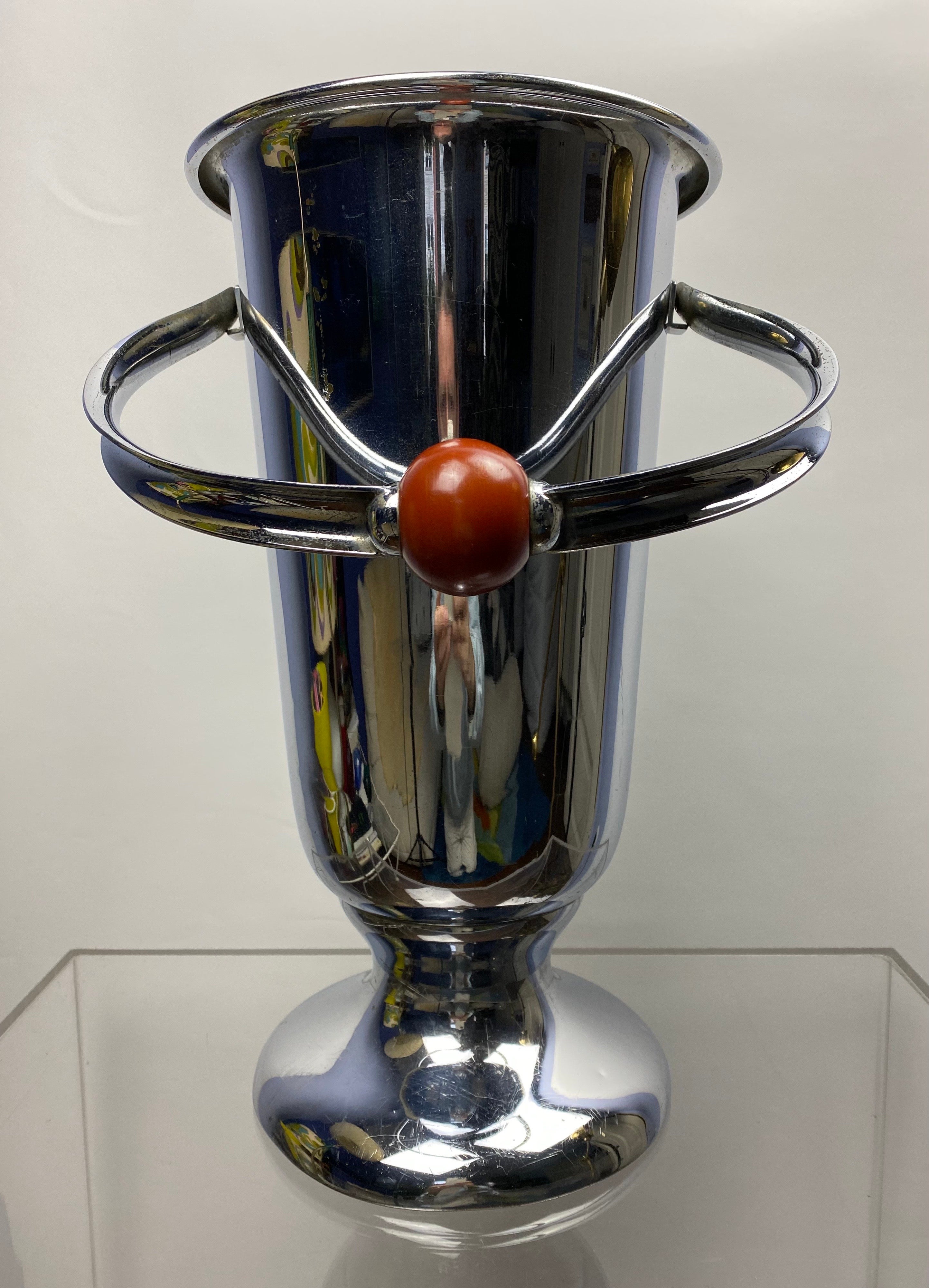 A rare and large impressive Art Deco Champagne or Wine Cooler from the WMF, Würtembergische Metallwarenfabrik, Germany, 1920s.
With a beautiful amber-colored ball of early half-synthetical plastic called Galalith mounted on the handle.
The