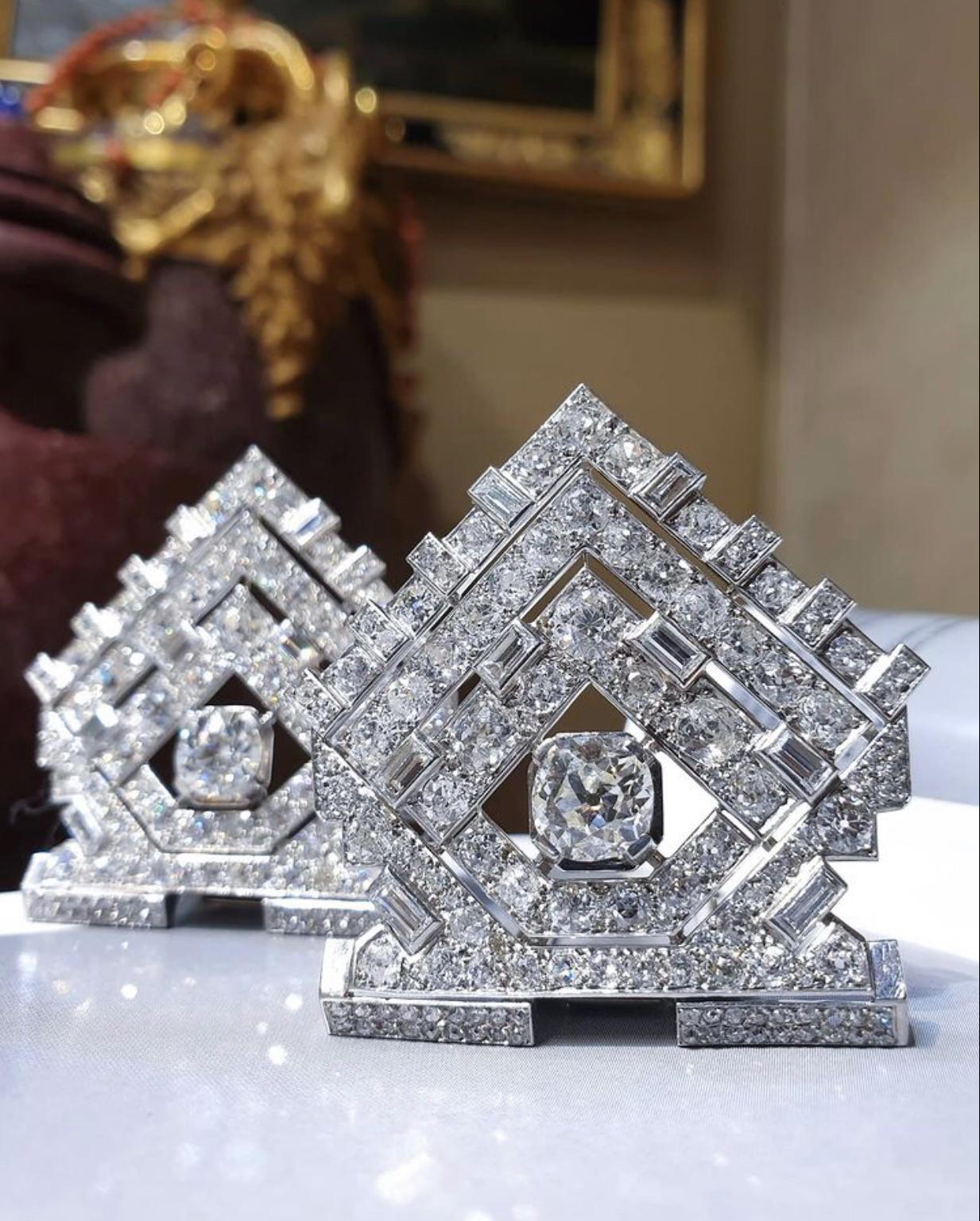 An exceptional Art Deco diamond and platinum brooch that transforms into a pair of dress clips. Totaling approximately 25 carats of diamonds, with the 2 main stones approximately 1.8 carats each. The design is in the style of Cartier. Made in