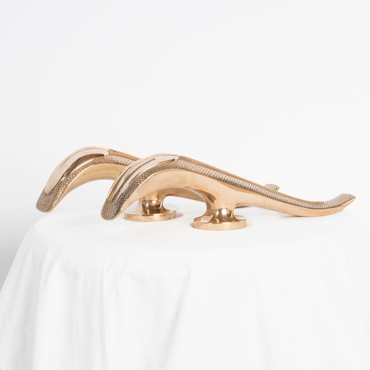 A stunning set of exquisite large and heavy French Art Deco door handles, most likely utilized for restaurant entrances, showcasing an elegant spoon and fork design.

Crafted from solid brass, these handles carry a substantial weight and showcase a