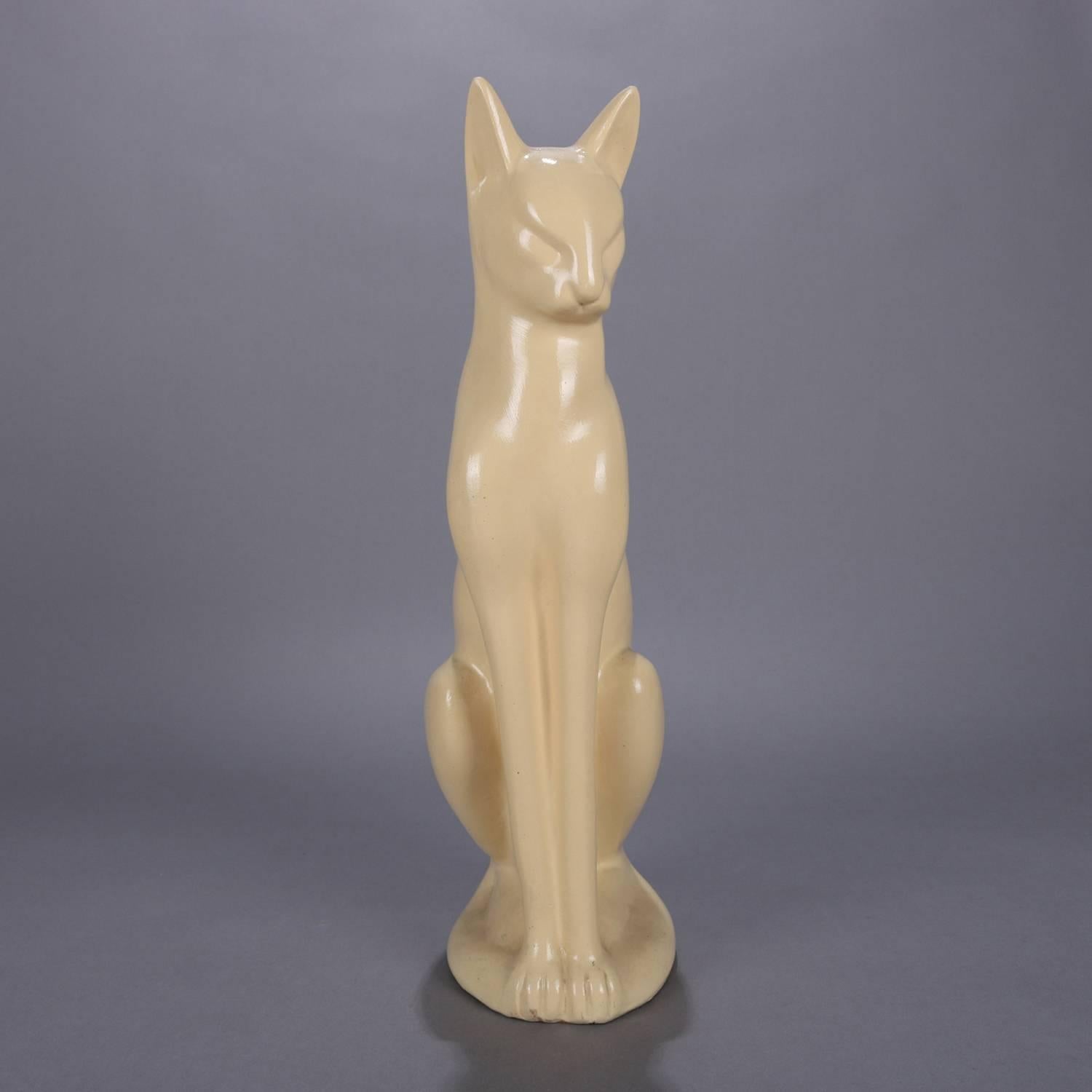 Large Art Deco figural ceramic sculpture of seated Siamese cat in cream glaze, circa 1930.

Measures: 18