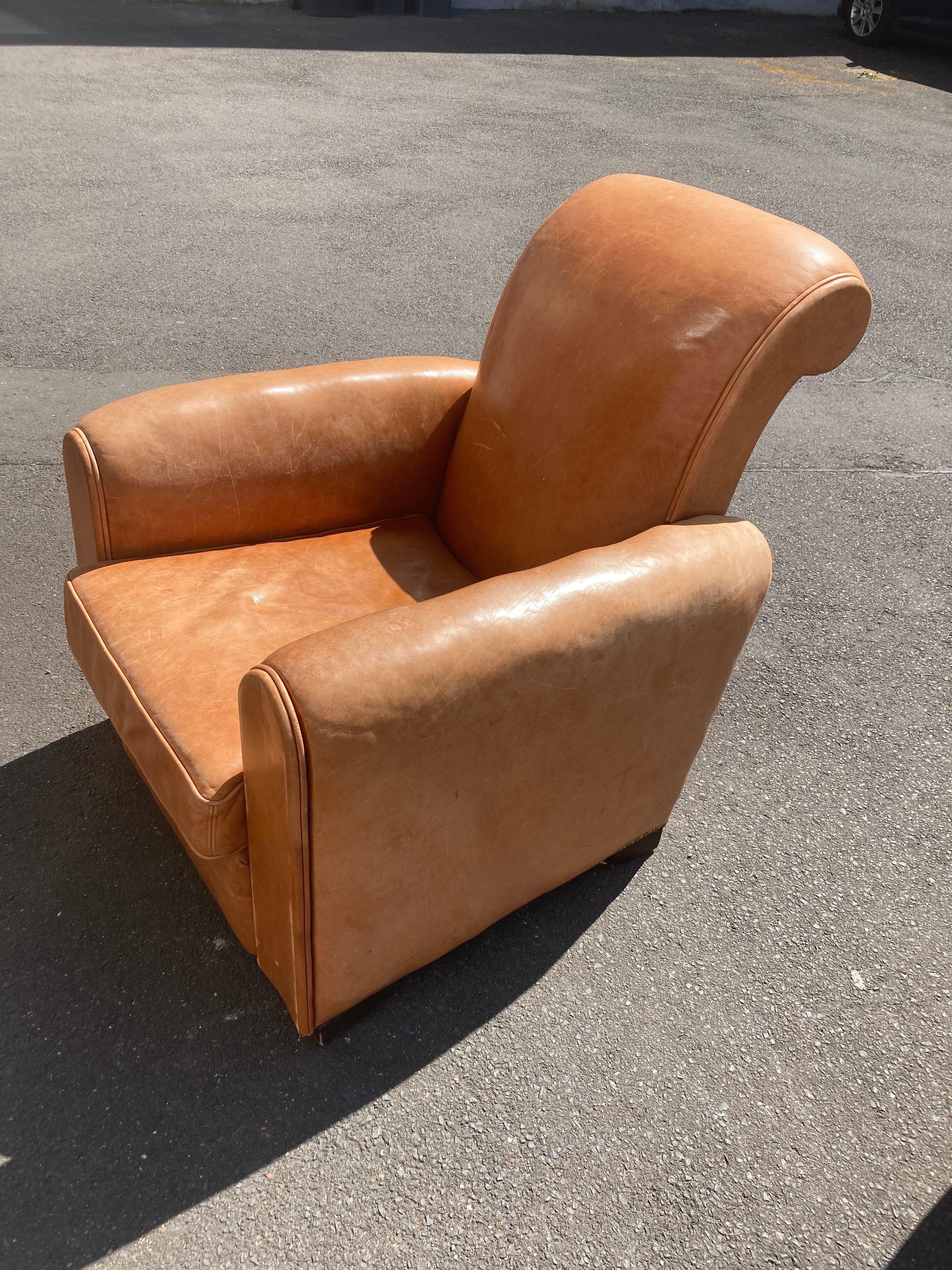 Large Art Déco leather Club Chair. France 1930s.
The Club Chair is in good Original condition from the 1930s.
Light brown leather, slightly cognac-colored.
Rare beautiful Design, the two fronts of the Club Chair are made of leather -covered wood. No