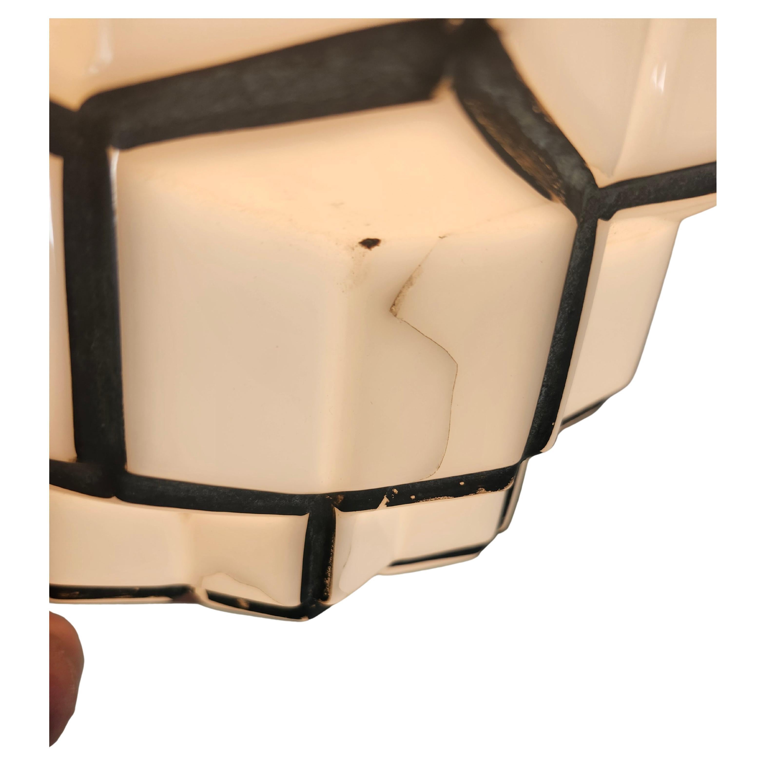 Fantastic American Art Deco Milk Glass Skyscraper Form Pendant Light C1930 Rewired with the original porcelain socket in excellent condition. Square lines to this form as opposed to the other one we have listed.
A small minor crack which stopped