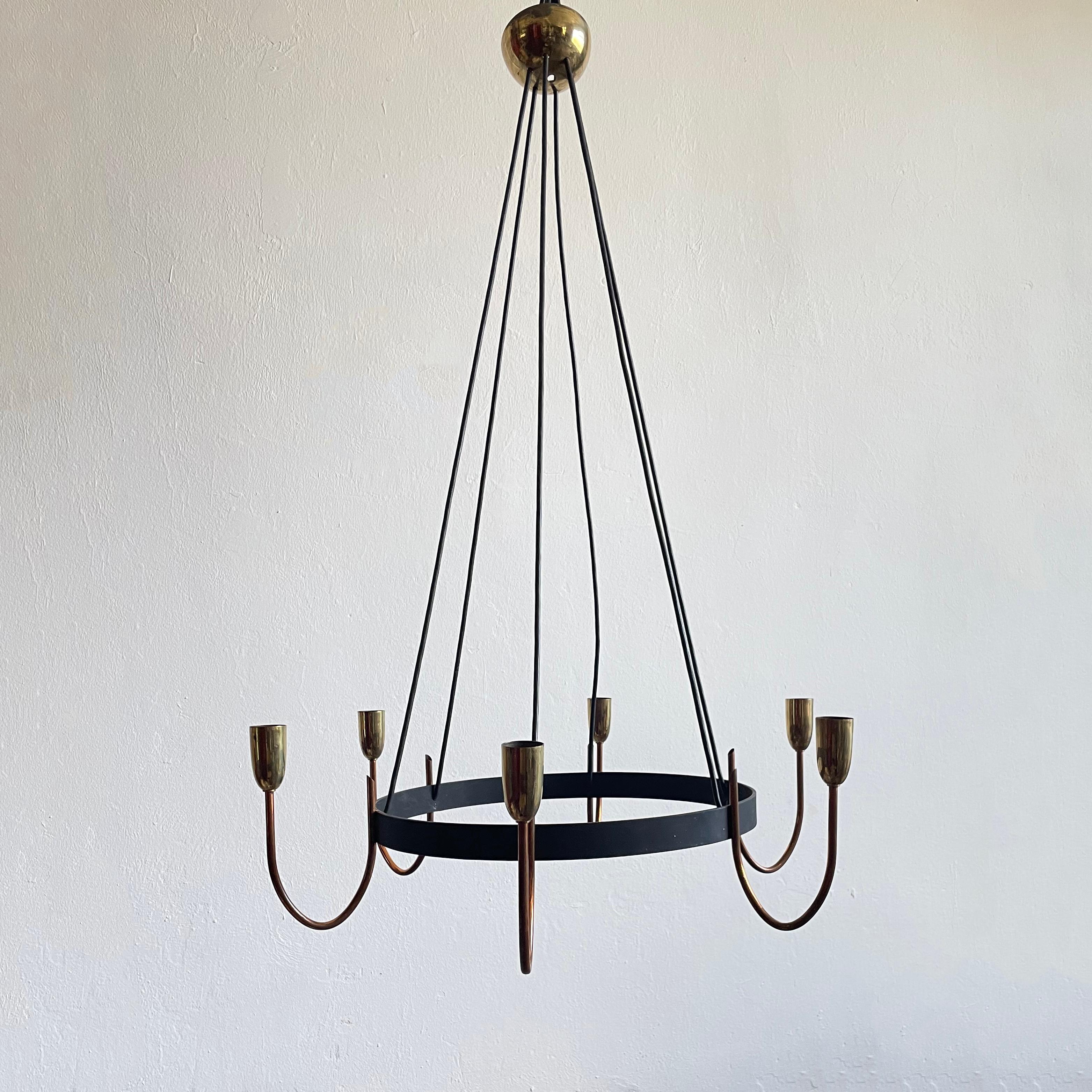 Large Austrian metal chandelier manufactured in the 1930s - 1940s in Art Deco style with modernist features

6x E27 lamp socket

Total height is adjustable to the maximum length of 150 cm

The chandelier is in good vintage condition and in