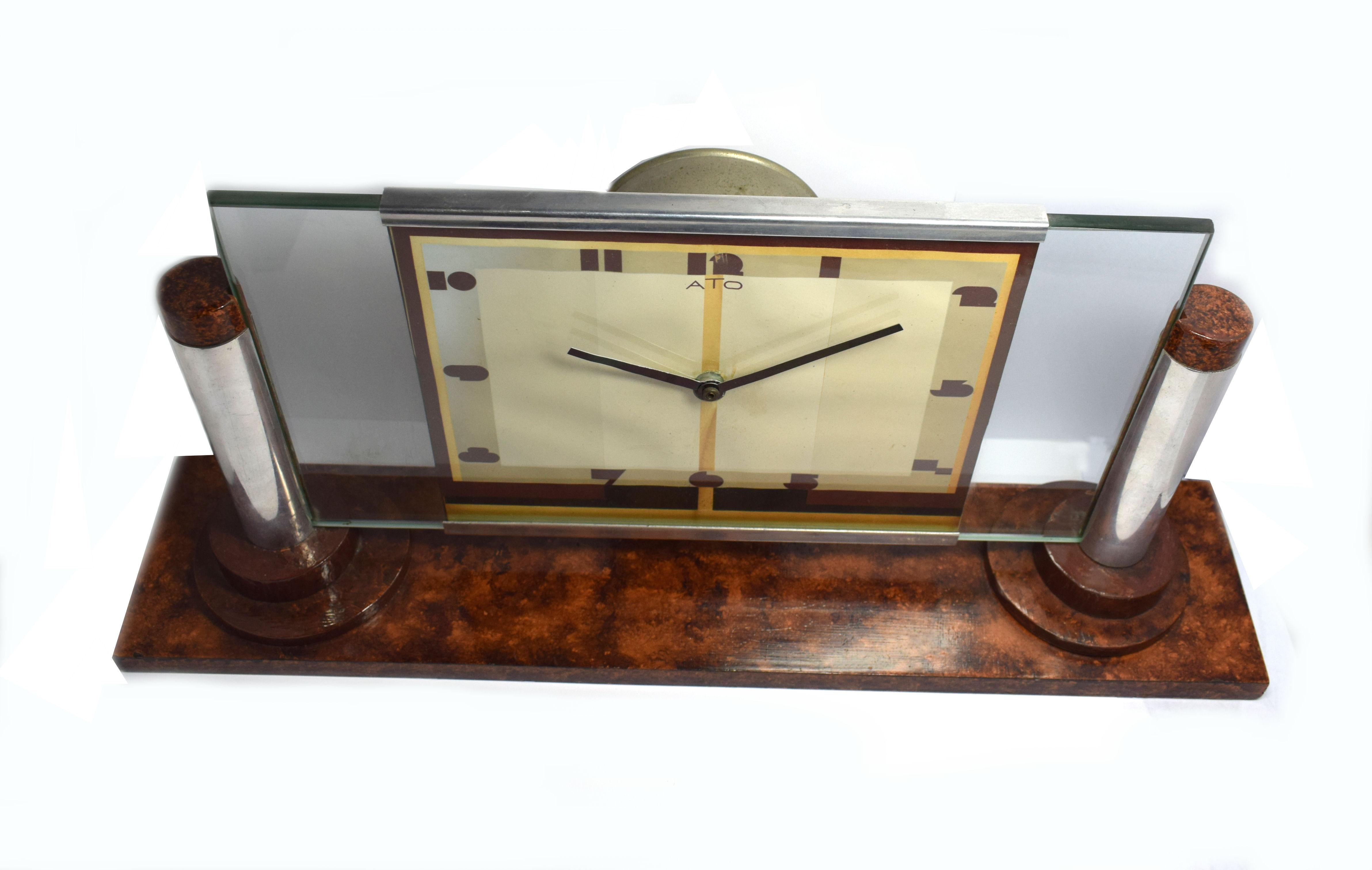 One of the more rare Art Deco clocks is this wonderfully stylish and totally authentic 1930s Art Deco clock by ATO the French clock makers. This clock has a mixtures of materials, mainly wood, chrome and glass. Very iconic looking clock that