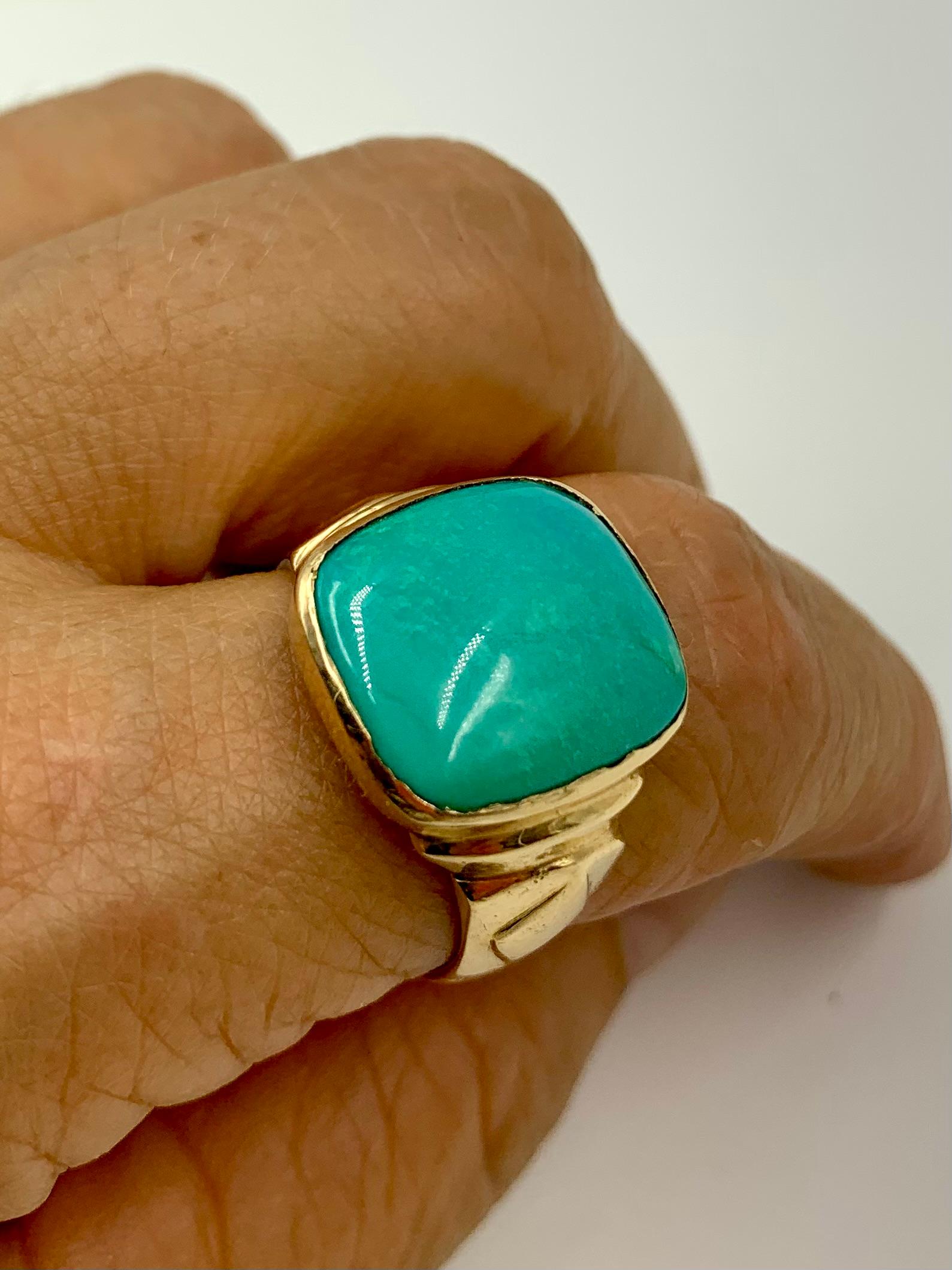 Large and impressive Art Deco period natural turquoise and 14K yellow gold signet ring
Early 20th Century
The beautiful blue-green, large 16mm by 14mm turquoise gemstone set in a stylish Art Deco yellow gold setting of fan shaped design with rhombus