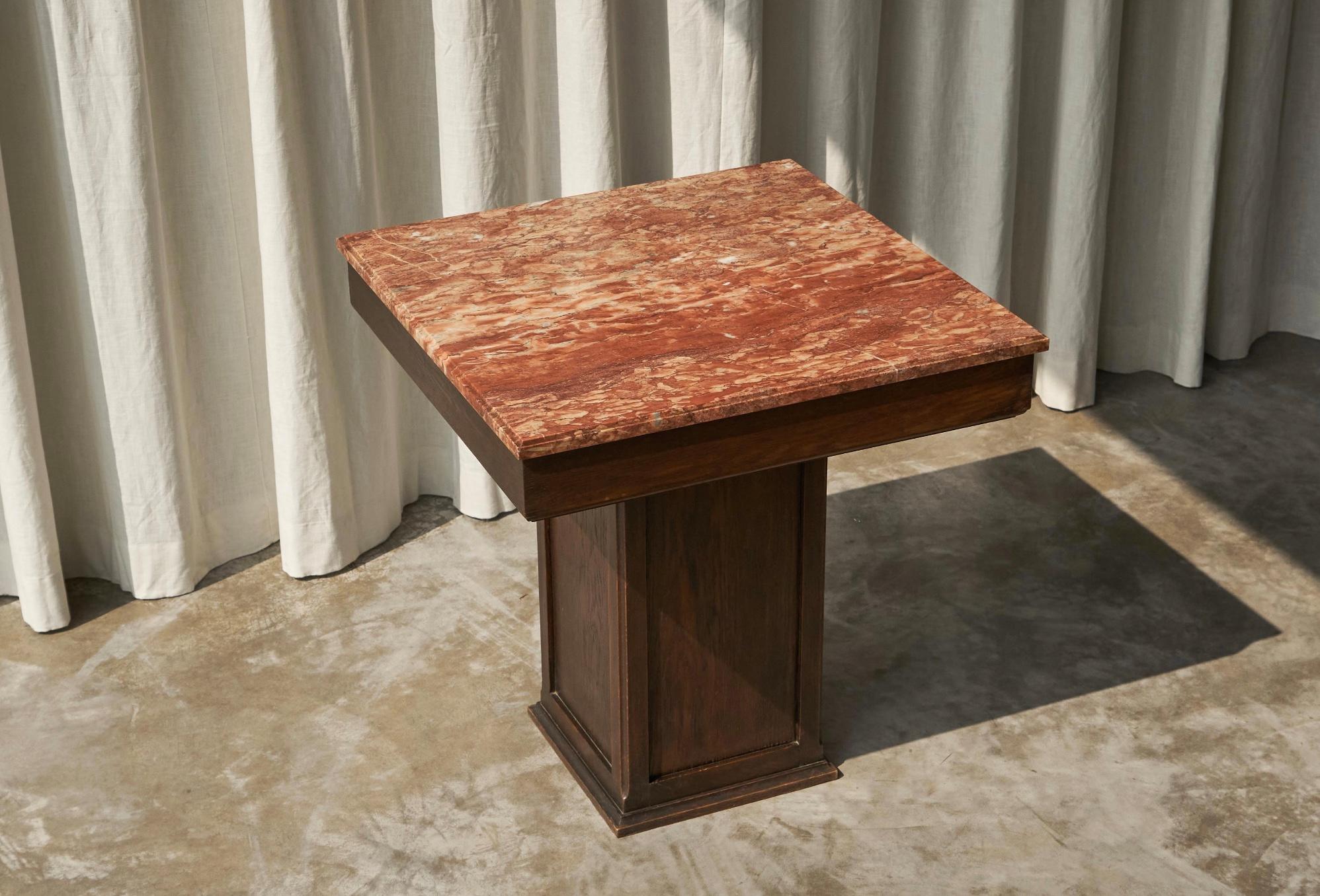Large Art Deco Pedestal Side or Gueridon Table in Oak and Expressive Red Marble 1930s.

What an amazing piece this is! This 1930s Art Deco pedestal side table shows great proportions and quality. It was well made by a true craftsman, in beautifully