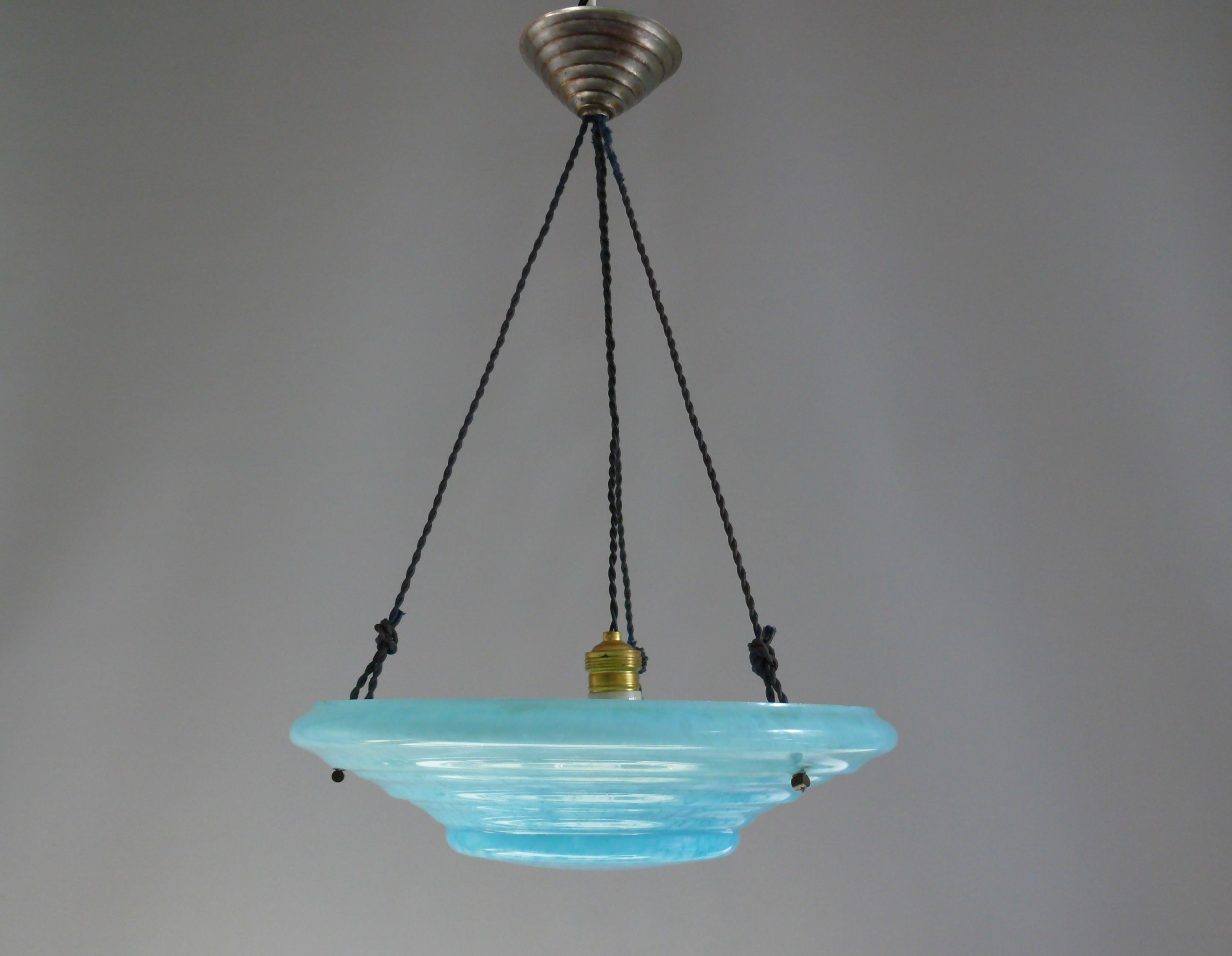 Large pendant light from the 1920s - 1930s with a blue textured glass shade and cable suspension. The large glass shade has a beautiful shape with radial steps and a blue texture with white reflections, similar to pointillism in