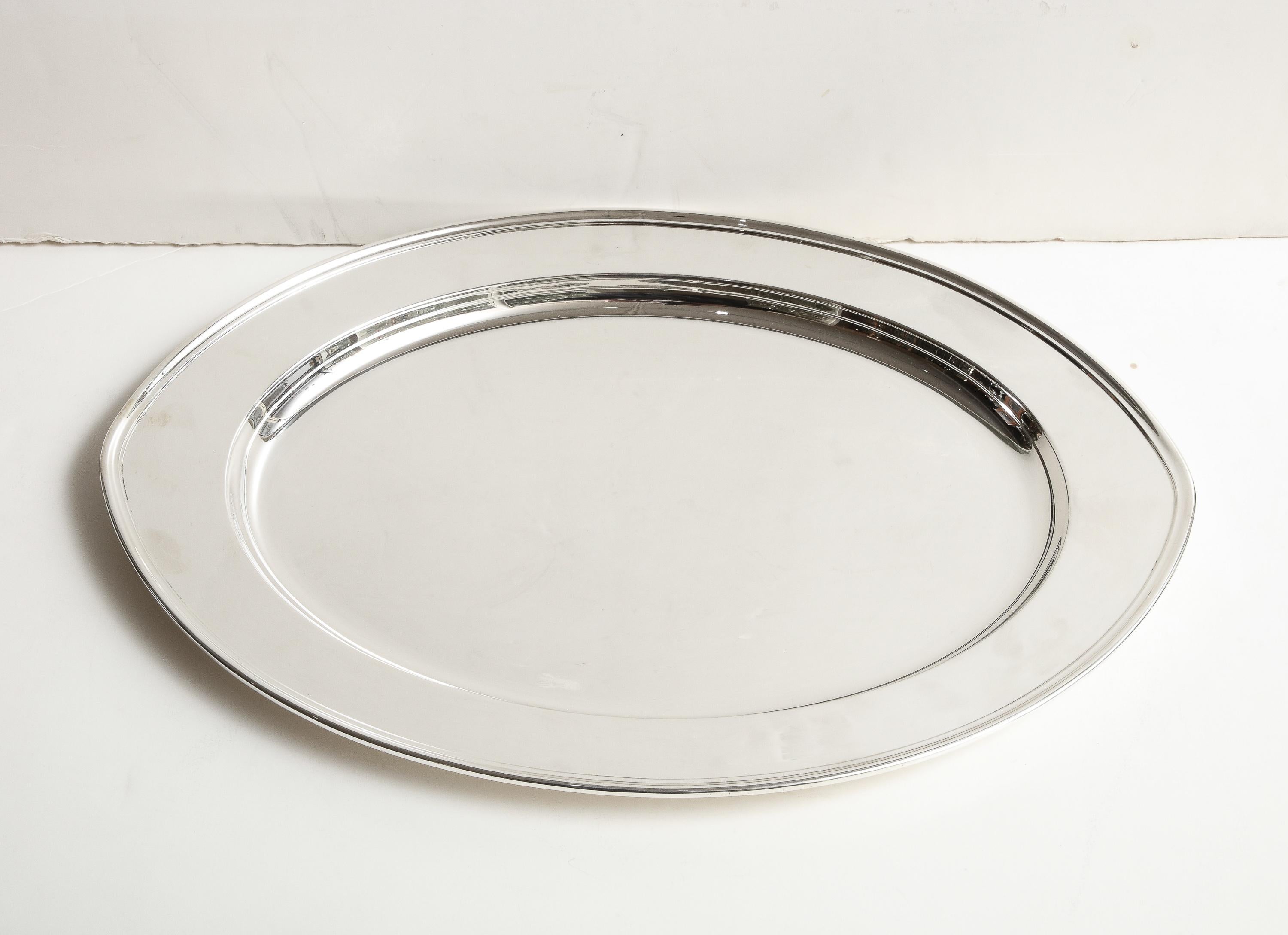 Large,  Art Deco Period, solid sterling silver serving platter/tray, Gorham Manufacturing Co., Providence, Rhode Island, year-hallmarked for 1933. Measures 18 3/4 inches wide (at widest point)  x 13 1/4 inches deep (at deepest point) x 1 inch high