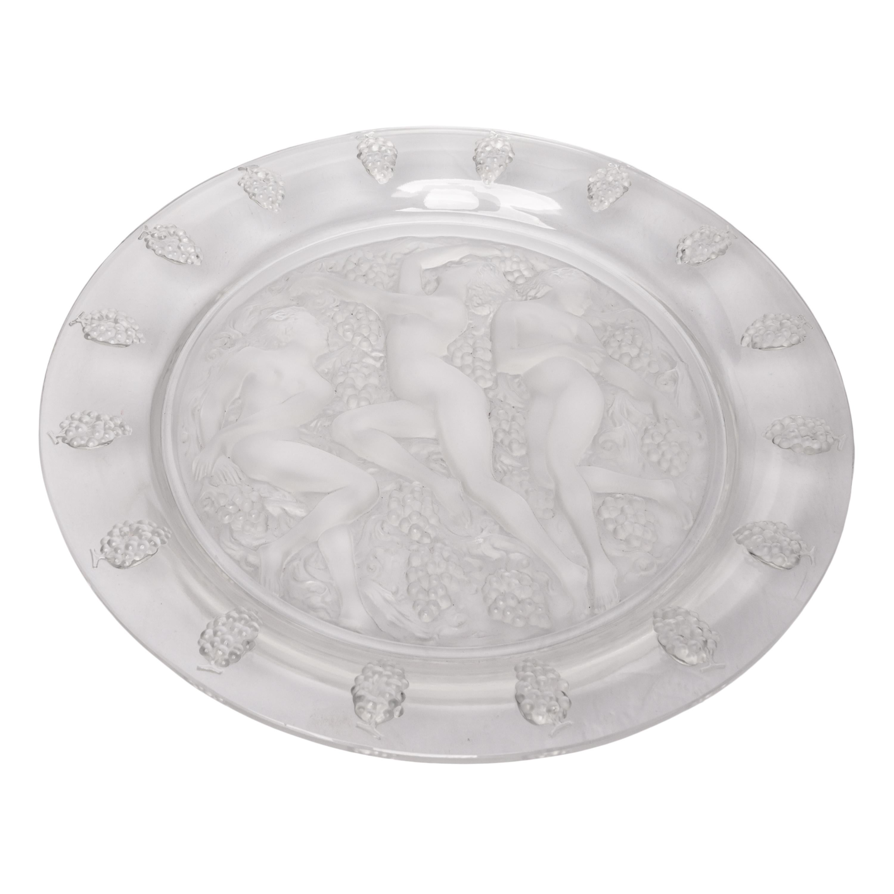 A large French Art Deco Cote d'Or (Bachantes) Lalique platter, signed, 1943.

The glass with elevated curved grapes decorated rim & frosted central section having three nude cavorting females amongst grapes; Clear round glass the elevated rim