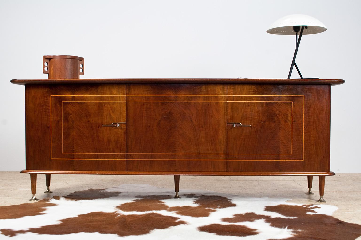 Large credenza in mahogany, walnut and brass, designed by Abraham Patijn during the early 1950s for Dutch manufacturer Zijlstra. Well executed sideboard with lovely art deco elements and a high glossy finish. The wood has a vivid look and feel with