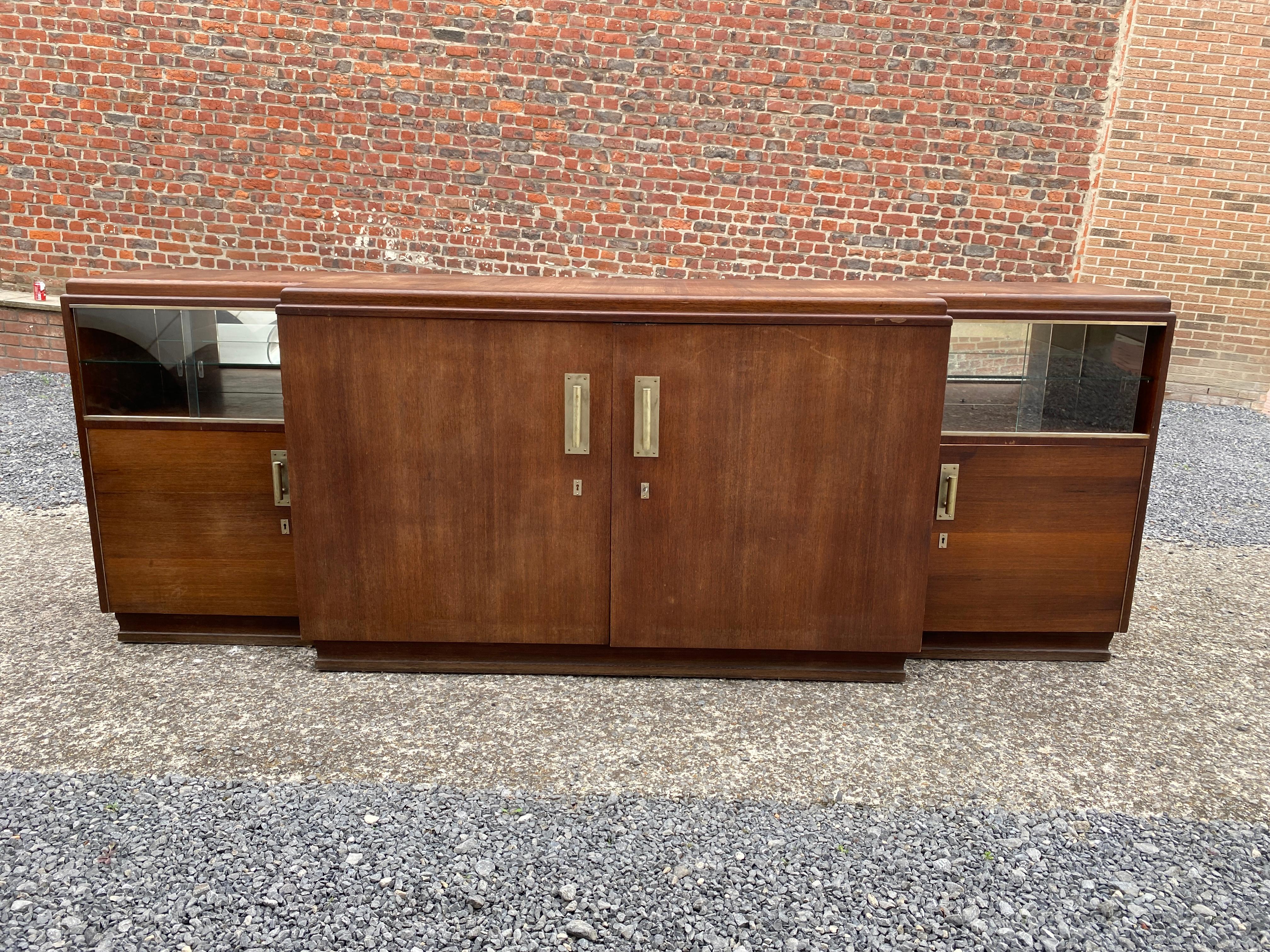 Large Art Deco sideboard in walnut, circa 1930.
the glass doors can be removed, the last photos show the sideboard with its niches without the windows.
  