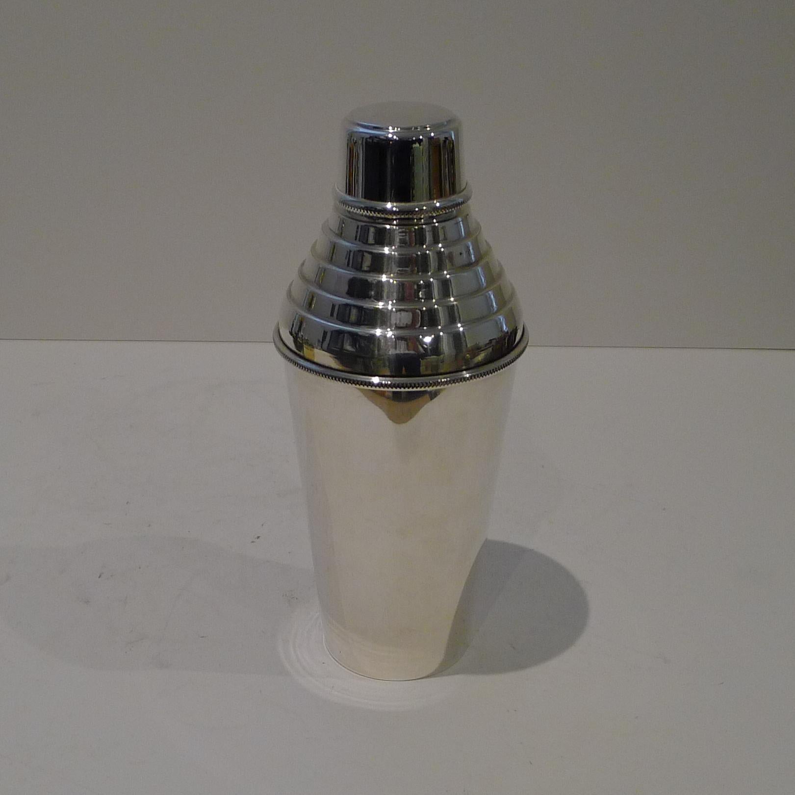 An iconic Art Deco cocktail shaker by an Iconic maker, Hukin and Heath.

Made from silver plate, it remains in outstanding original condition.  A good larger size standing 9 1/4
