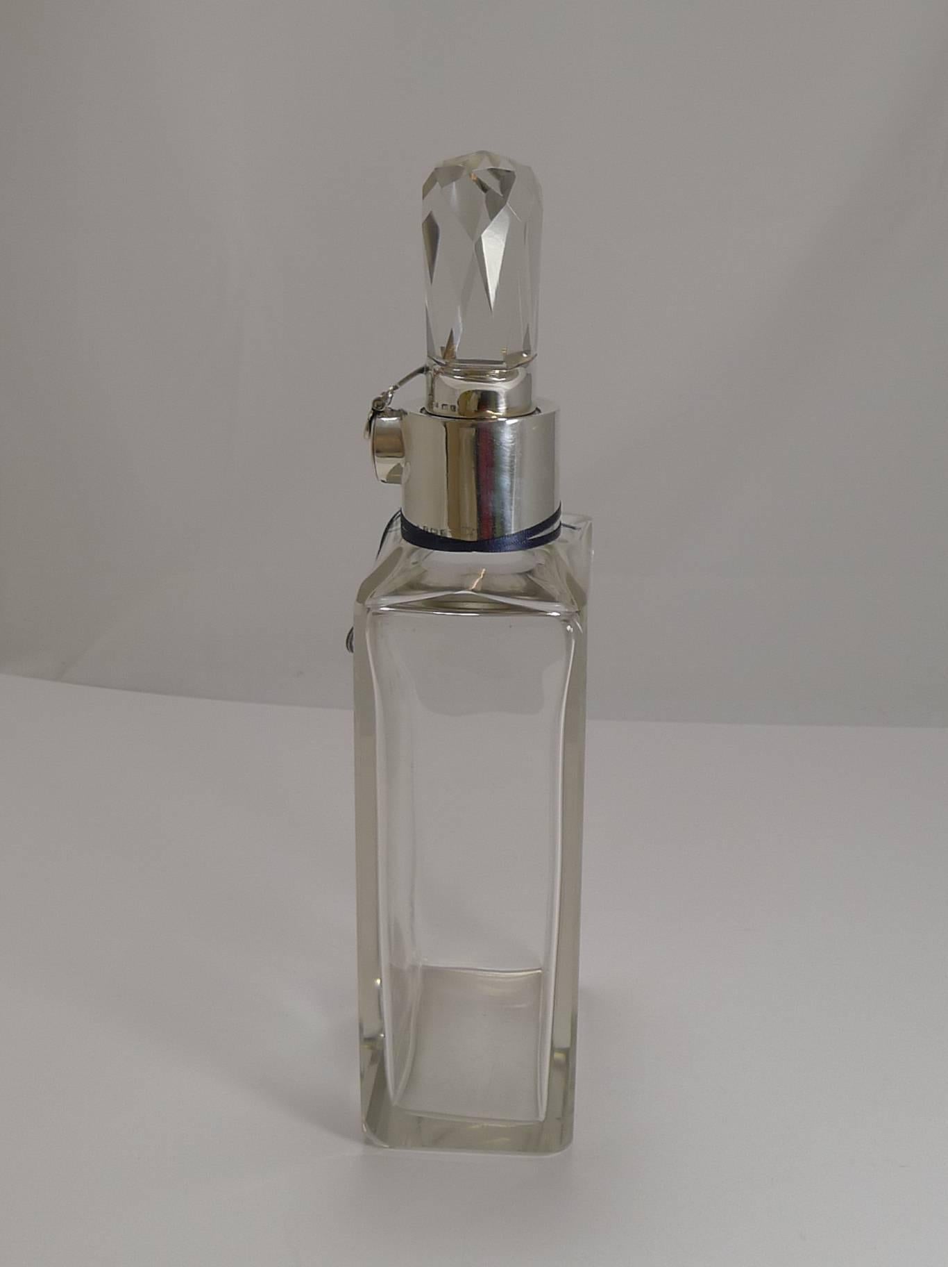 Highly sought-after and certainly scarce, this is a truly stylish crystal decanter with beautifully cut top. This one is an early example of its kind, undoubtedly designed by Hukin and Heath for the luxury London retailer, Asprey and Co. of Bond