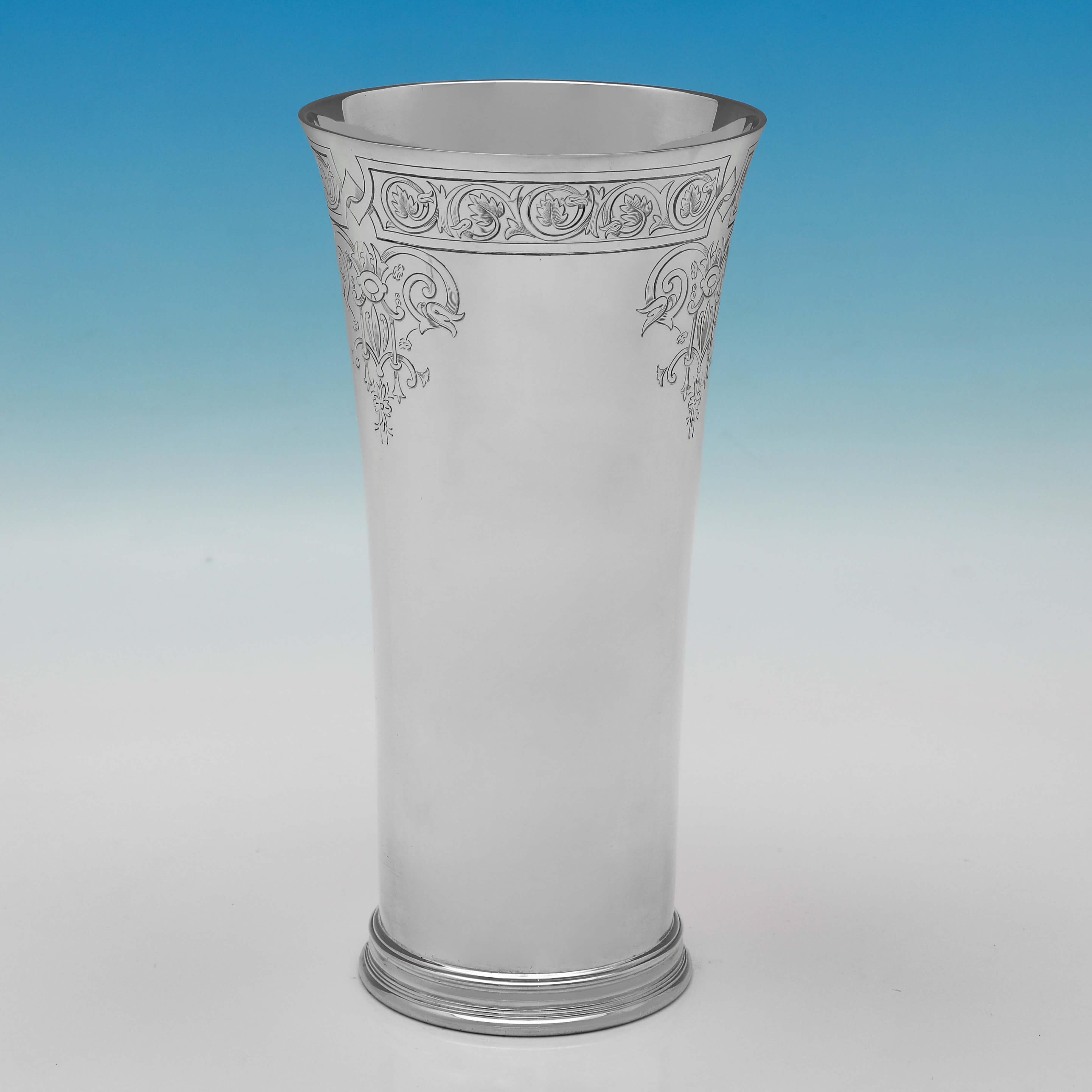 Hallmarked in London in 1932 by Richard Comyns, this stylish, Sterling Silver Vase, features engraved decoration around the rim, and a stepped base. 

The vase measures 9