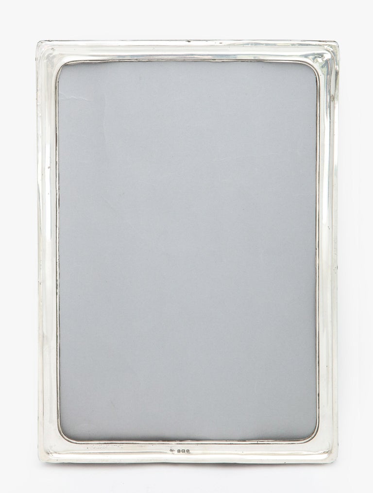 Large, Art Deco, sterling silver wood-backed picture frame, Birmingham, England, year-hallmarked for 1927, Sanders and MacKenzie - makers. Measures 13 1/2 inches high x 9 1/2 inches wide x 8 1/2 inches deep when easel is in open position. Will hold