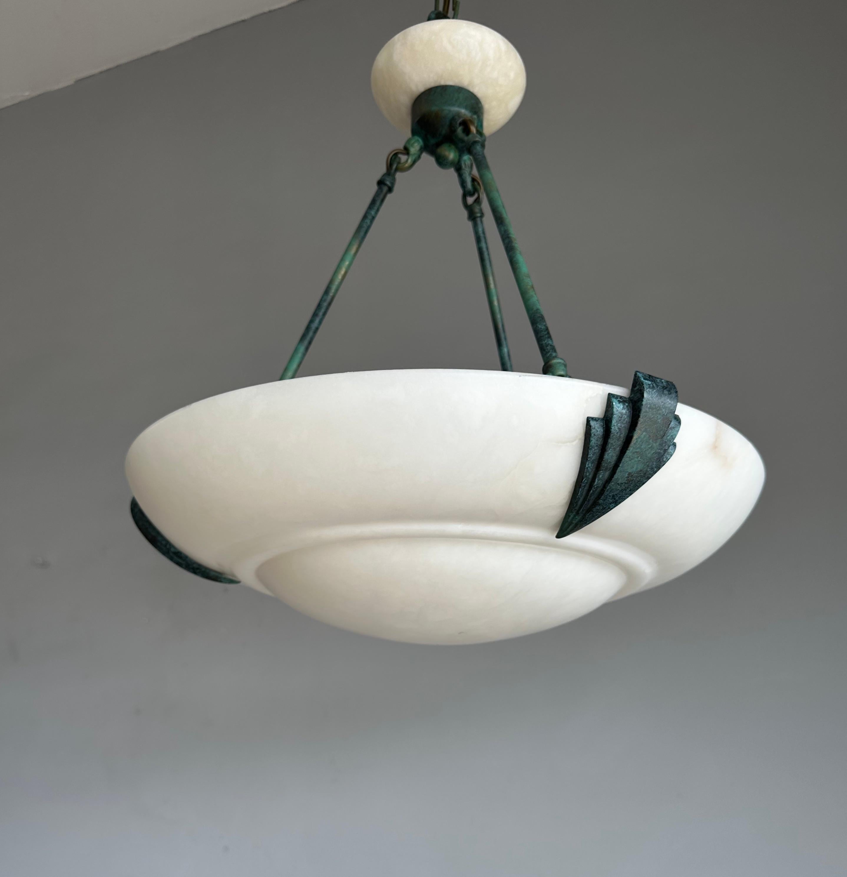 Large, excellent condition and rare design, three light chandelier.

If you like Art Deco light fixtures and you prefer to have them like new, then this 1970s alabaster and brass chandelier could be perfect for you. The combination of the pure white