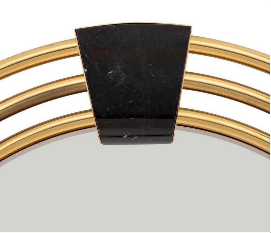 A very  large Art Déco style round mirror, of 3 concentric brass tubular elements framing a beveled mirror panel, held by four black veined Marble insets. 
circa 1950’s.  

#monumental #ArtDeco #Midcenury #modernist #Hoteldecor