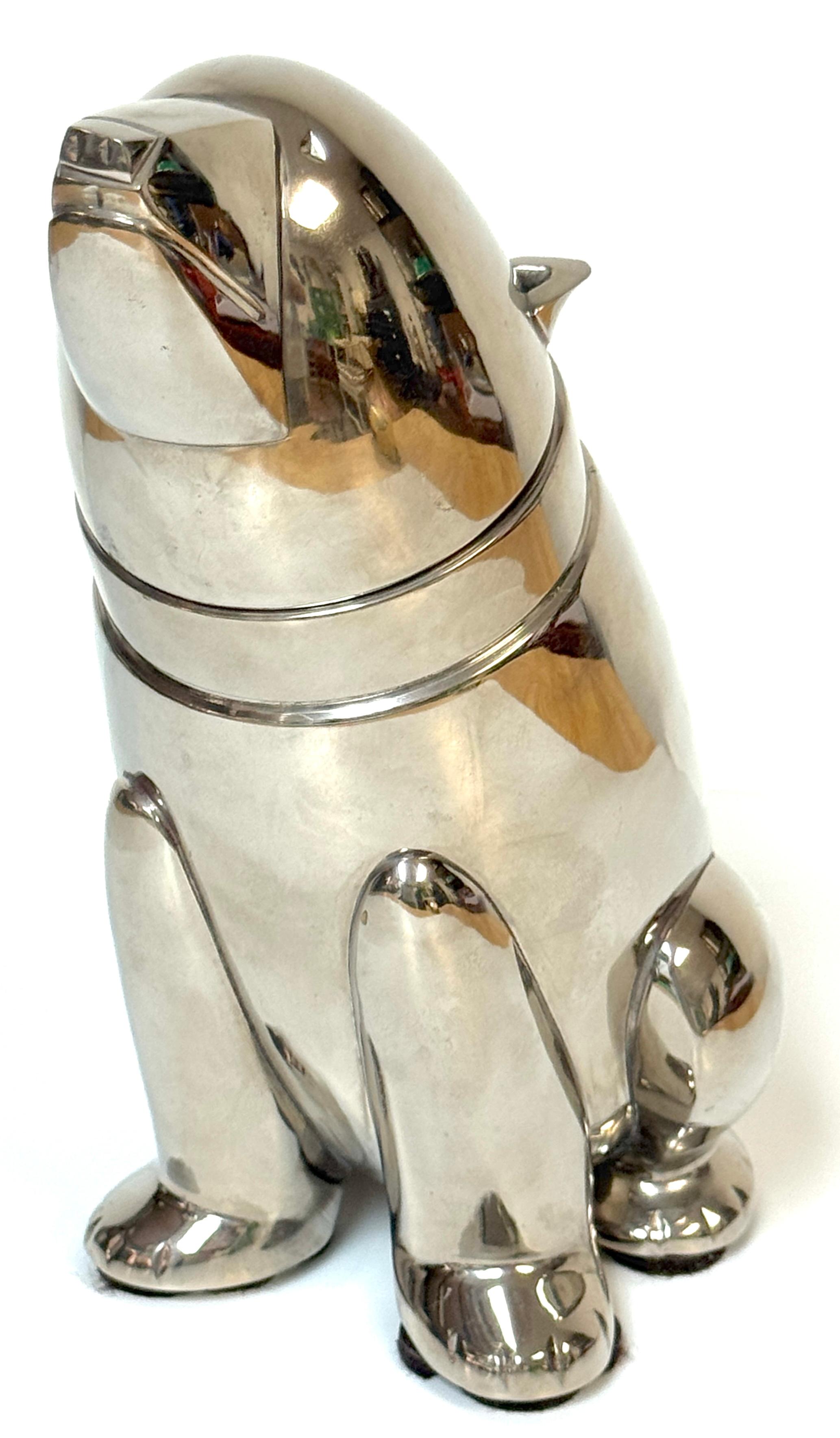 A striking and imaginative silver-plated cocktail shaker in the form of a stylized seated bear, blending whimsical form with refined Art Deco elegance. This sculptural piece features sleek, rounded contours and geometric detailing that echo the