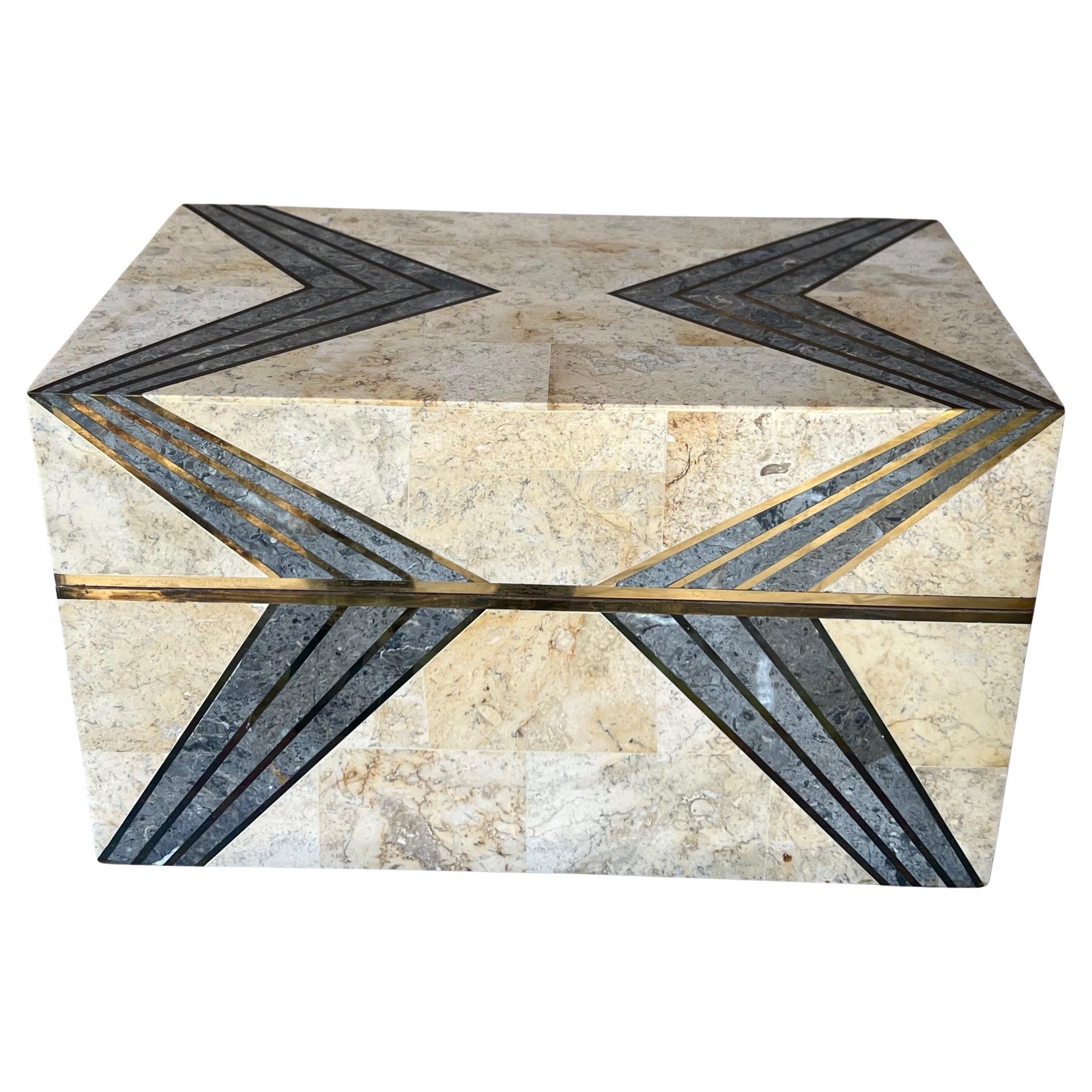 Large stone and copper inlaid box attributed to Maitland Smith. The box has a zig zag pattern in stone inlaid with copper trim, the inside is lined with brown felt.