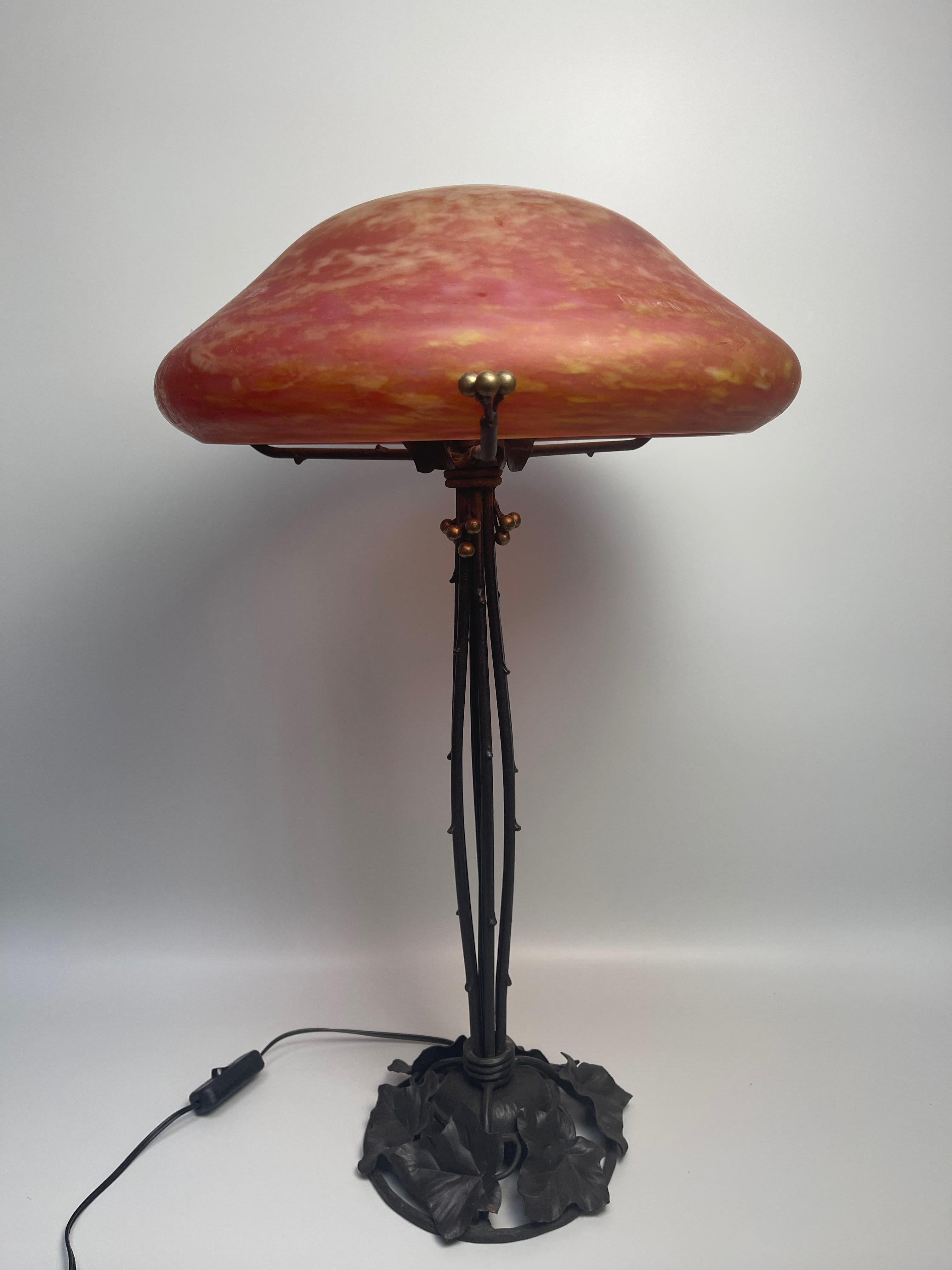 Large Art Deco wrought iron mushroom lamp with vegetal decor attributed to Camille Gauthier.

Glass paste signed engraved Daum Nancy France.



Very good condition, electrified.

Total height: 61 cm - 24 in
Foot diameter: 17 cm
Glass paste