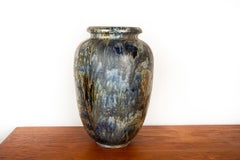 Large Art Deco vase, in glazed and iridescent blue stoneware, Roger Guérin, 1930