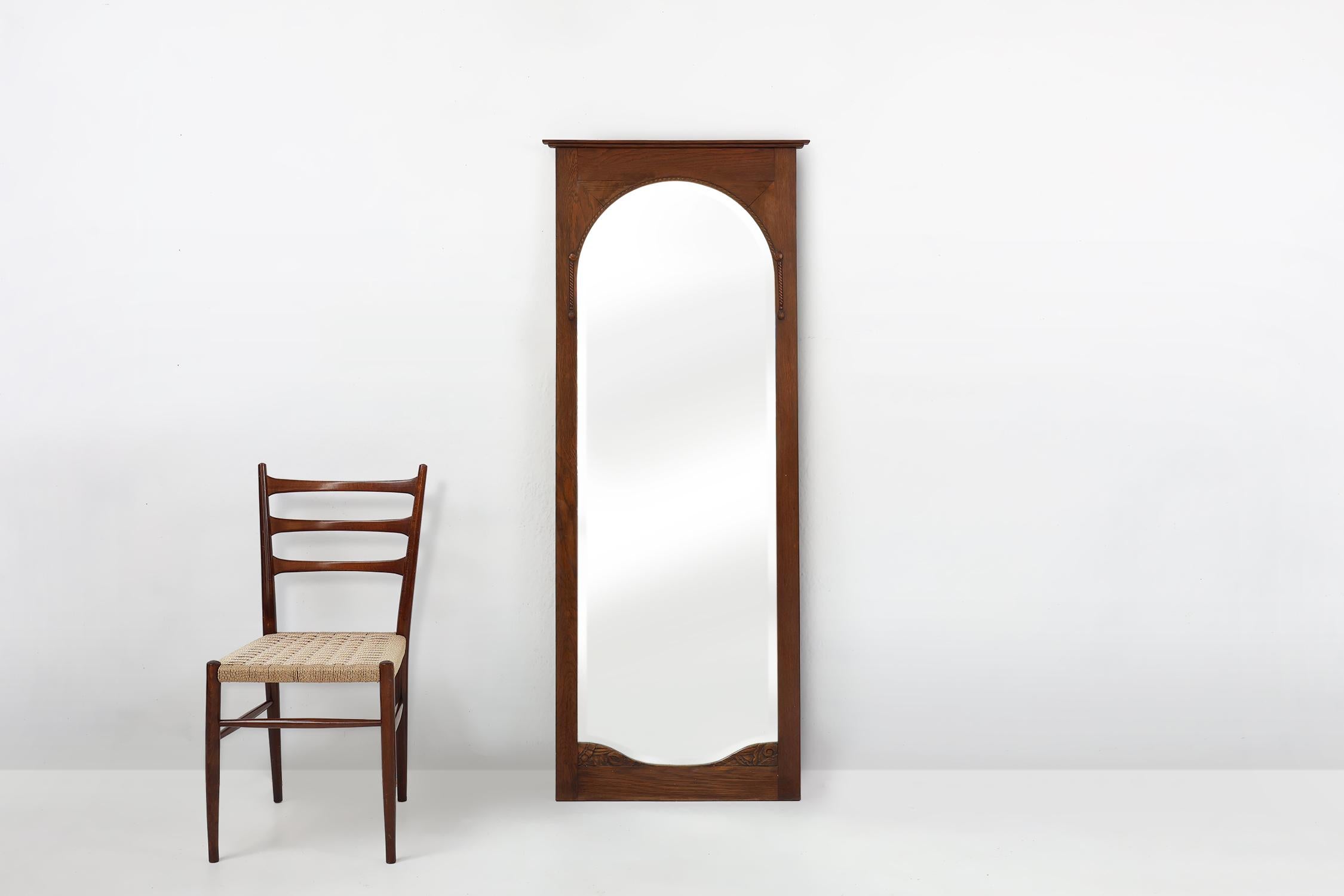 Belgium / 1930 / mirror / oak, mirror / Art Deco

A timeless Art Deco full length beveled wall mirror with warm solid oak frame and facet cut mirror. Crafted in the 1930s in Belgium. This mirror has subtile carvings and elegant lines.

An elegant