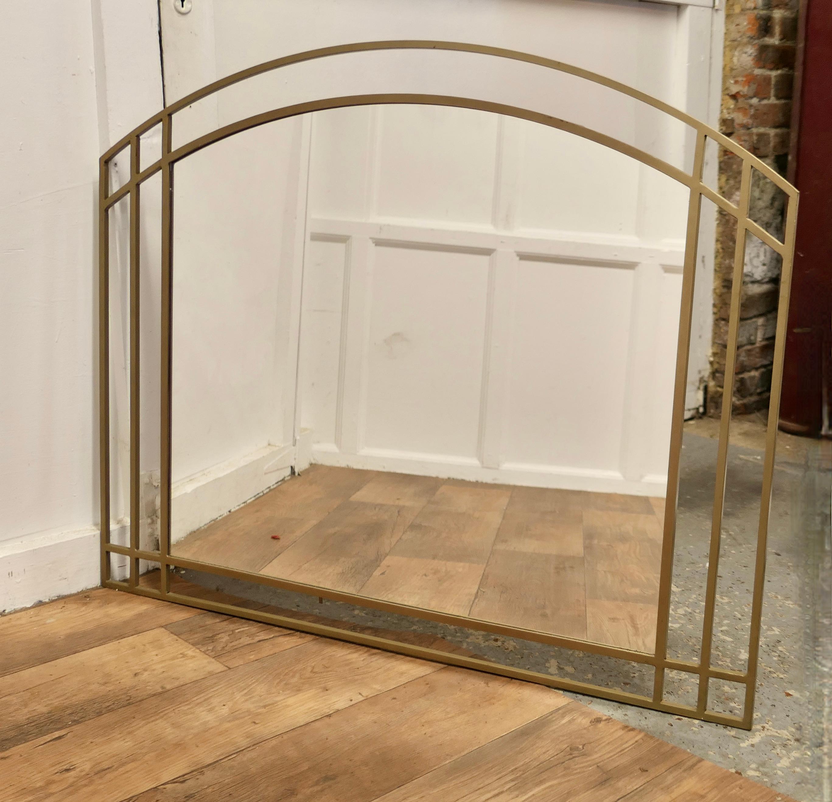 Large Art Deco Wall Overmantel Mirror  

This Stylish Mirror is set in a 5” Gold coloured steel rod frame with an arched top 

This is  a very rare piece and would work well either as an overmantel or as a wall mirror 
The overall size 43” wide and