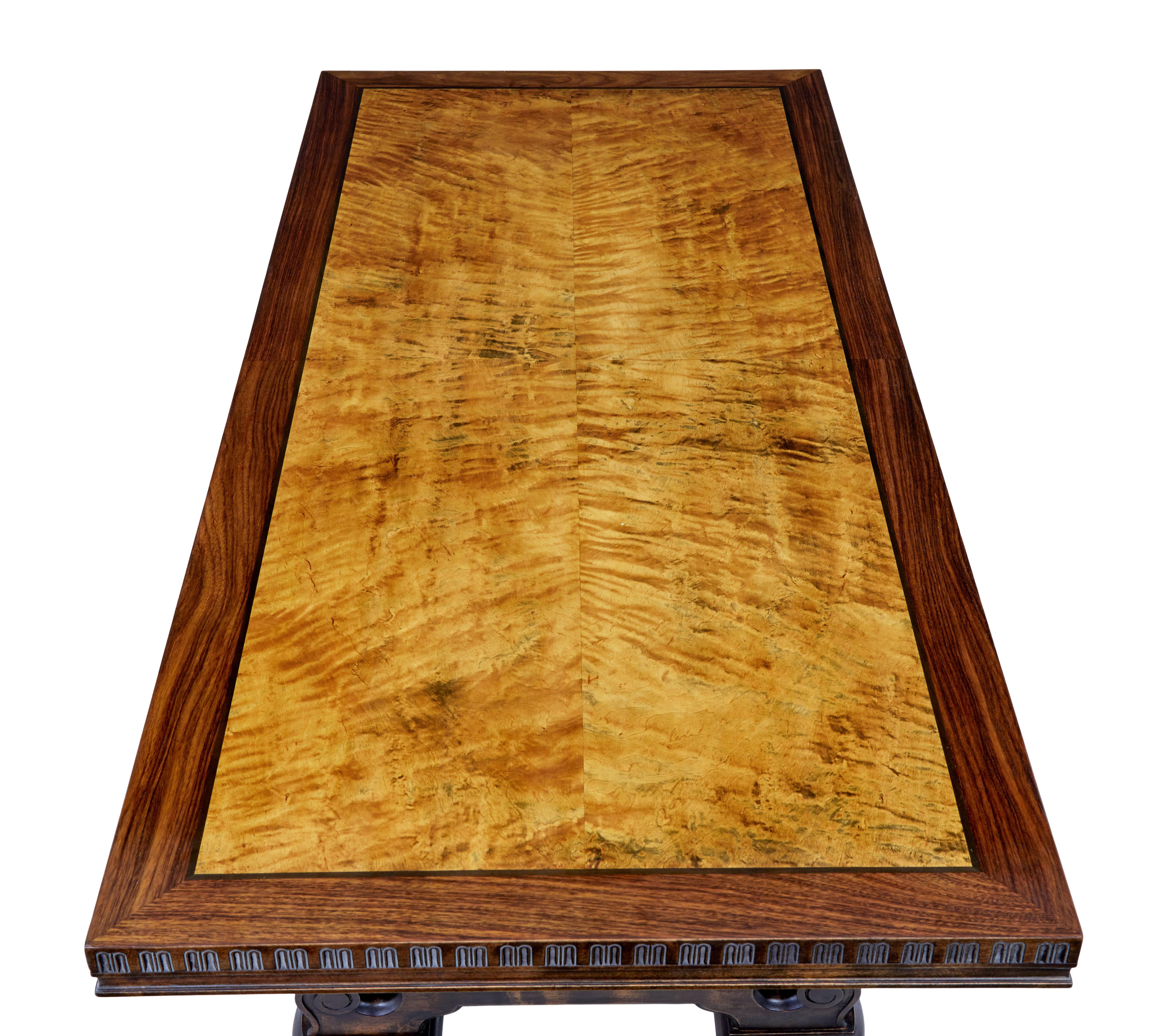 Large Art Deco walnut and birch coffee table, circa 1930.

Here we offer an Swedish art deco period coffee / lounge table of large proportions.

Rectangular top with a main quarter sawn veneered birch centre, ebonised stringing and a walnut