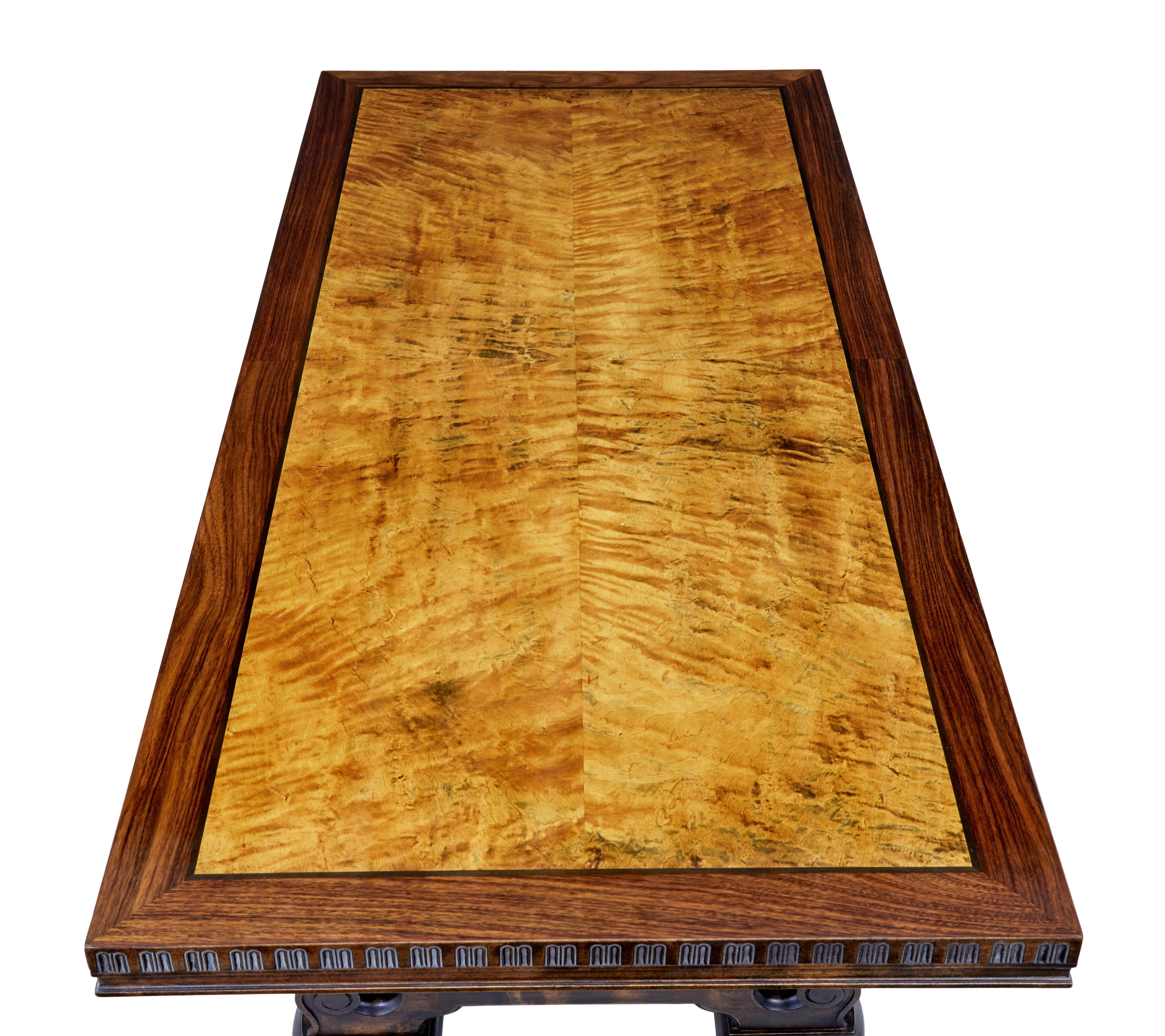 Large art deco walnut and birch coffee table circa 1930.

Here we offer an a Swedish art deco period coffee / lounge table of large proportions.

Rectangular top with a main quarter sawn veneered birch centre, ebonised stringing and a walnut outer